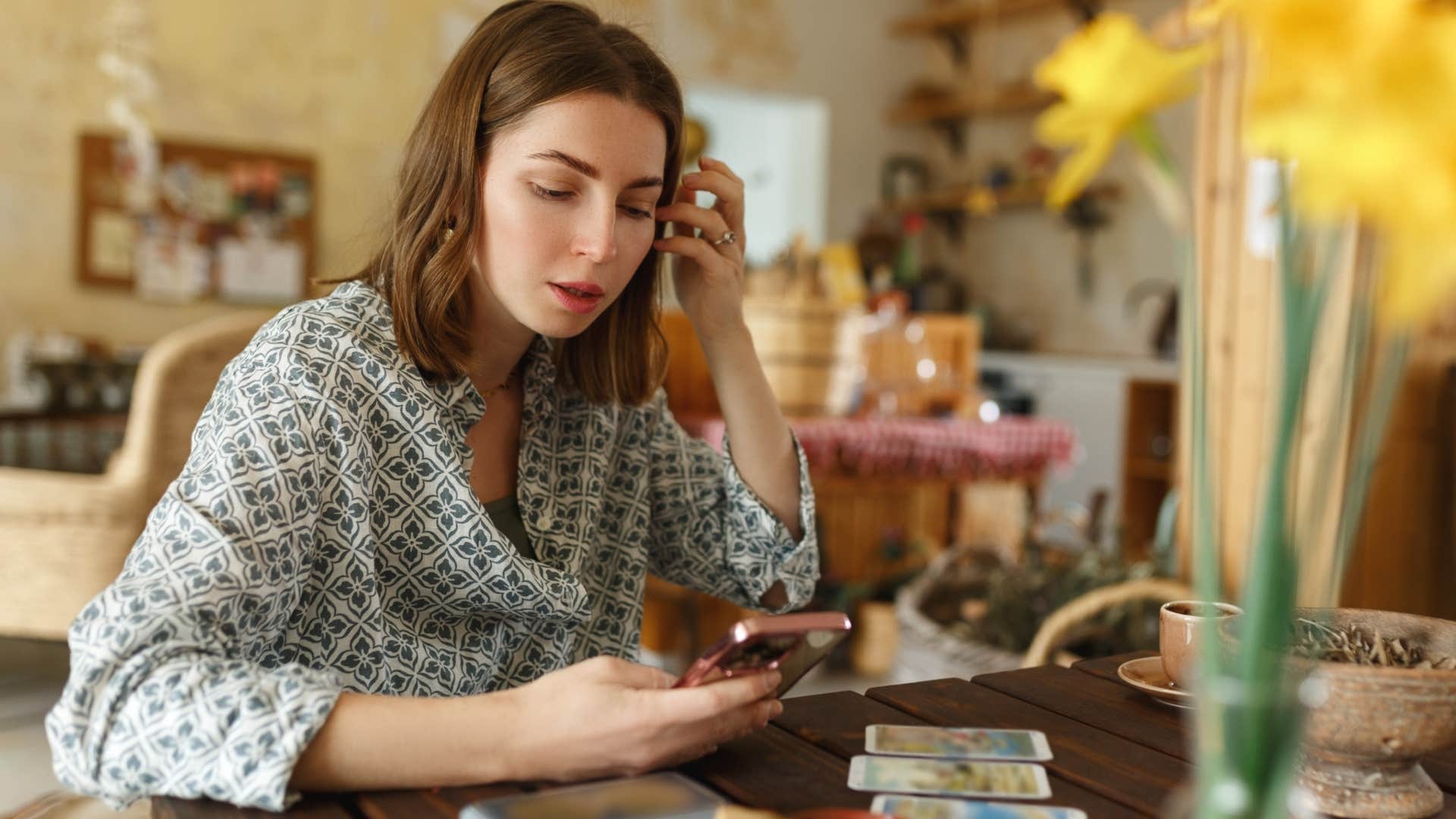woman looking at her horoscope using astrology as an excuse