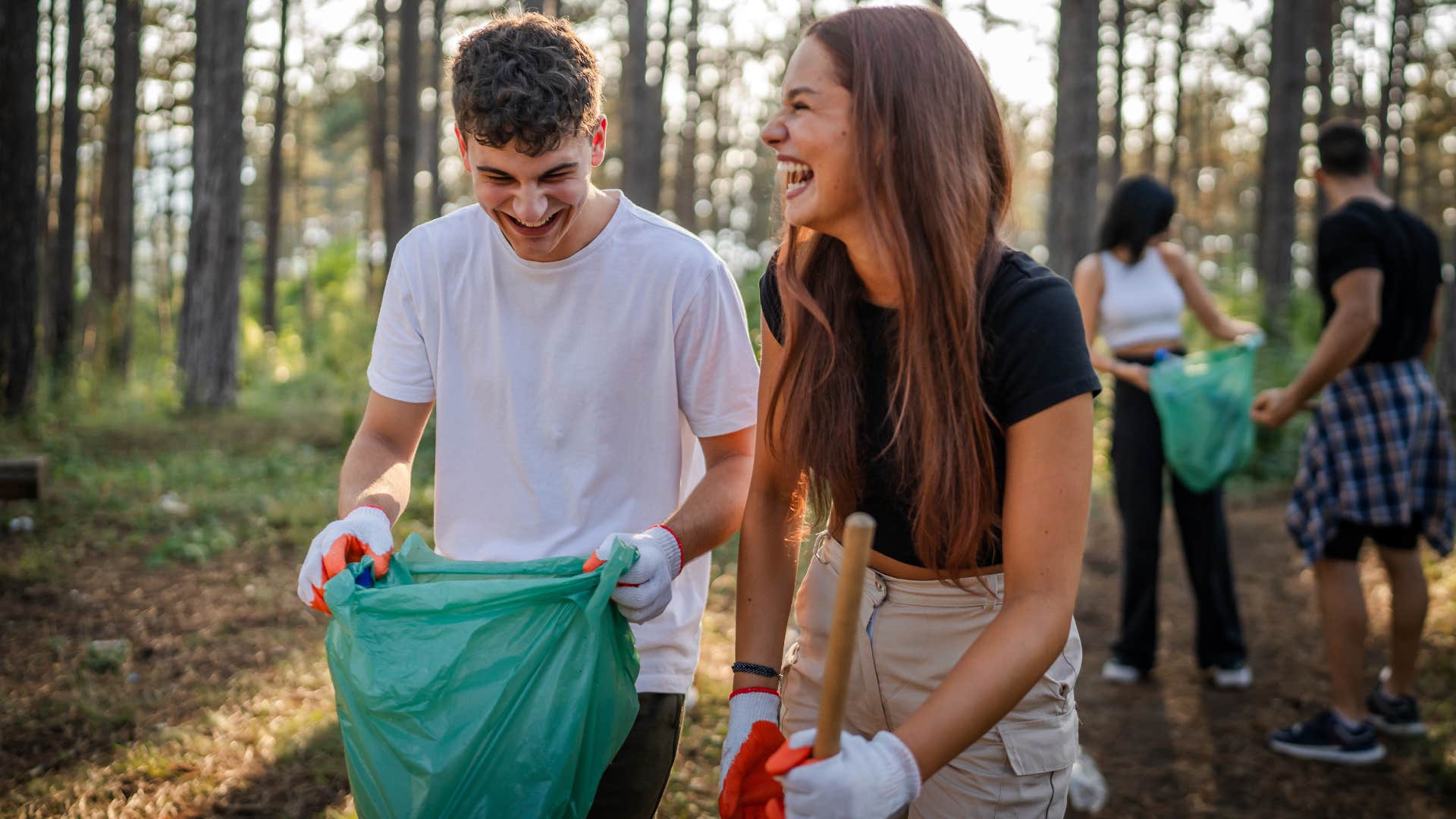 couple with quiet integrity cleaning up trash