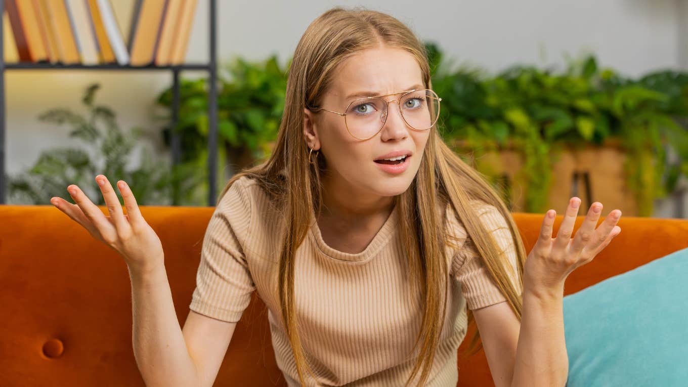 Things That Instantly Annoy People Who Were Raised By Frugal Parents young woman annoyed by financial choices of others
