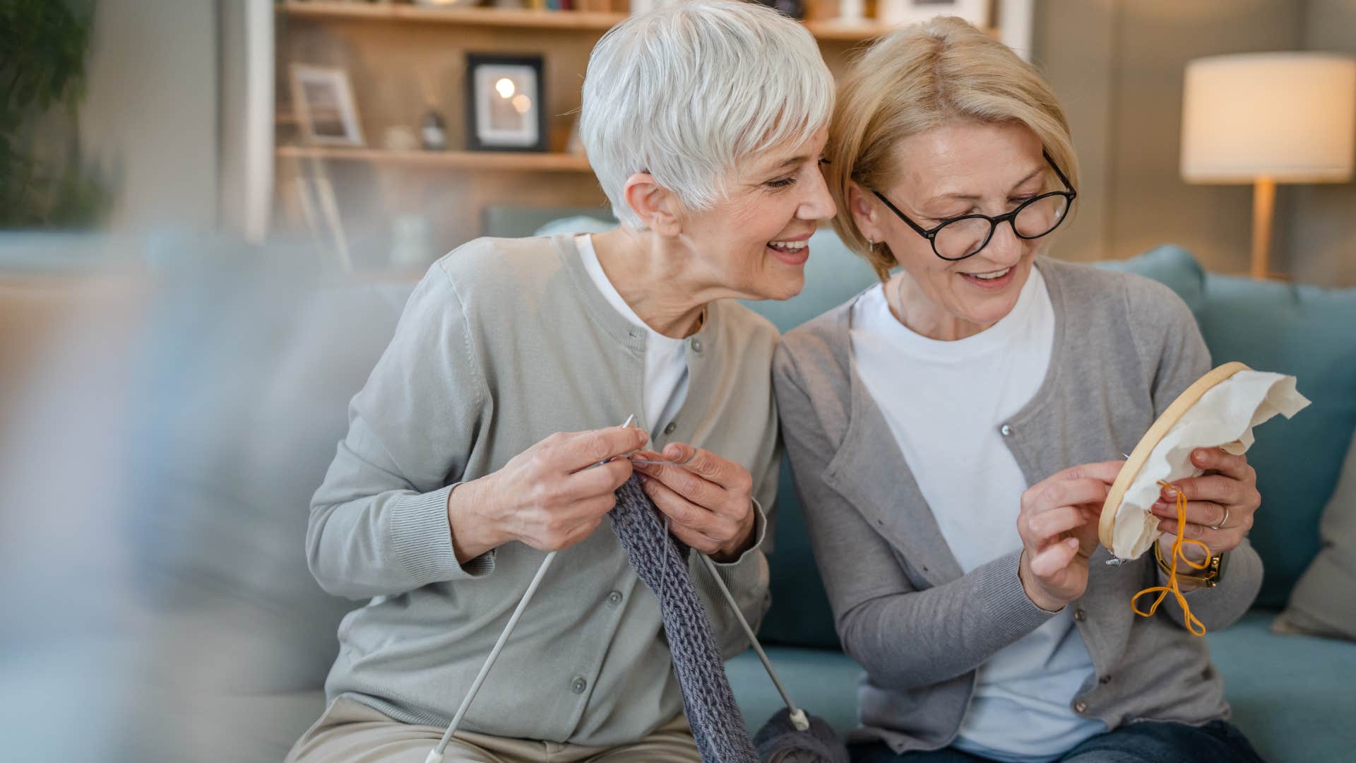 Women smiling with creative projects and hobbies at home.