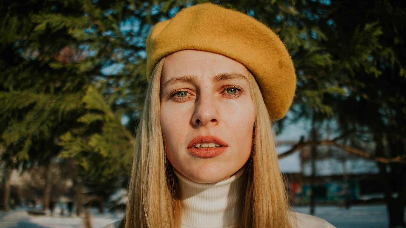 Things People Do In Public That Reveal How Unhappy They Really Are sad unhappy woman standing outside in beret