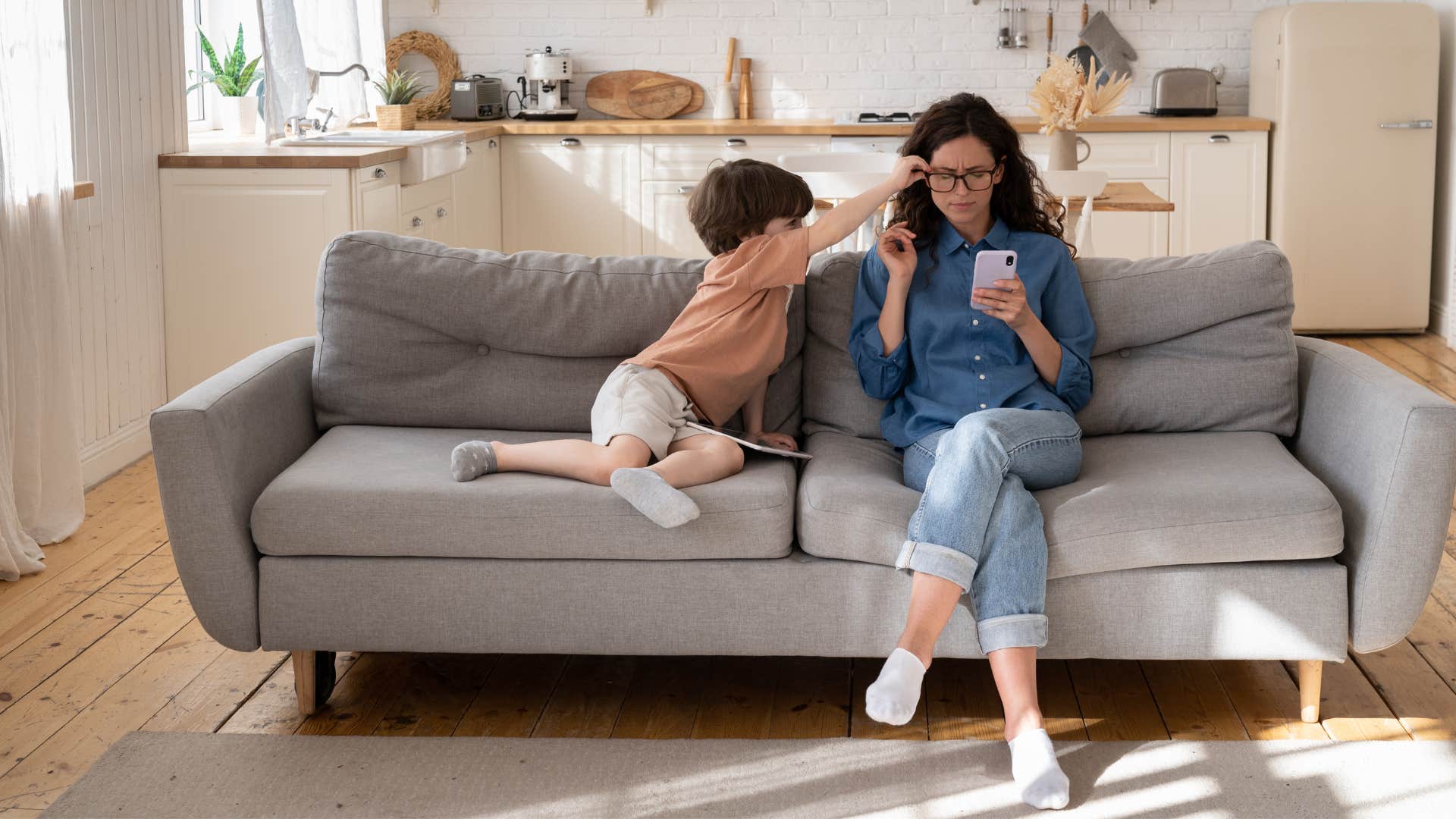mom ignoring son's needs to be on her phone