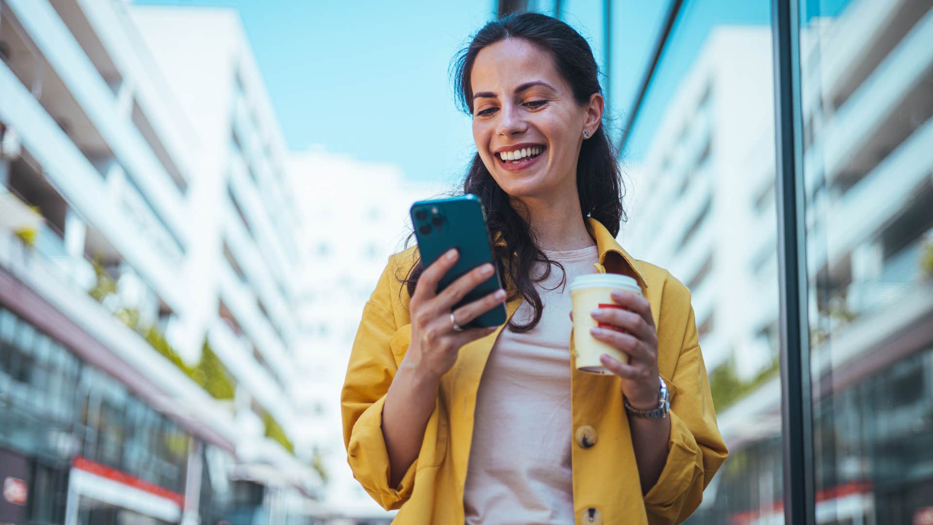 woman messaging on her phone overusing emojis