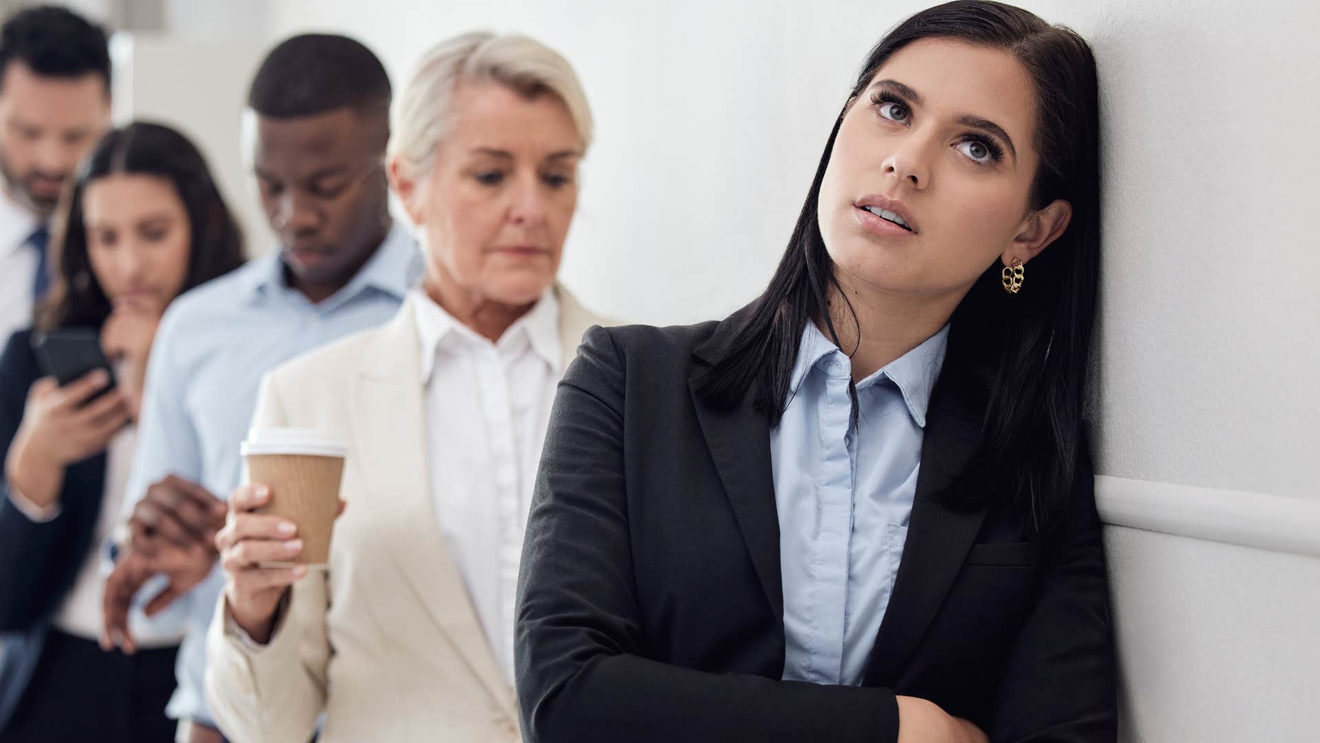 annoyed woman waiting in line