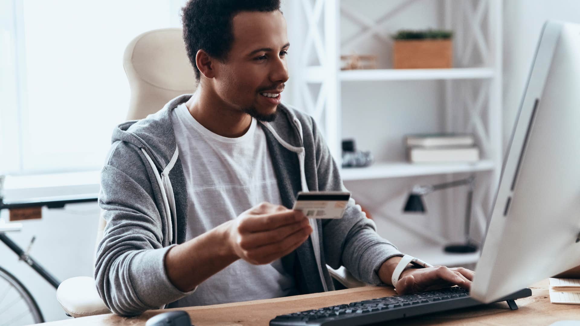 man buying something online with credit card