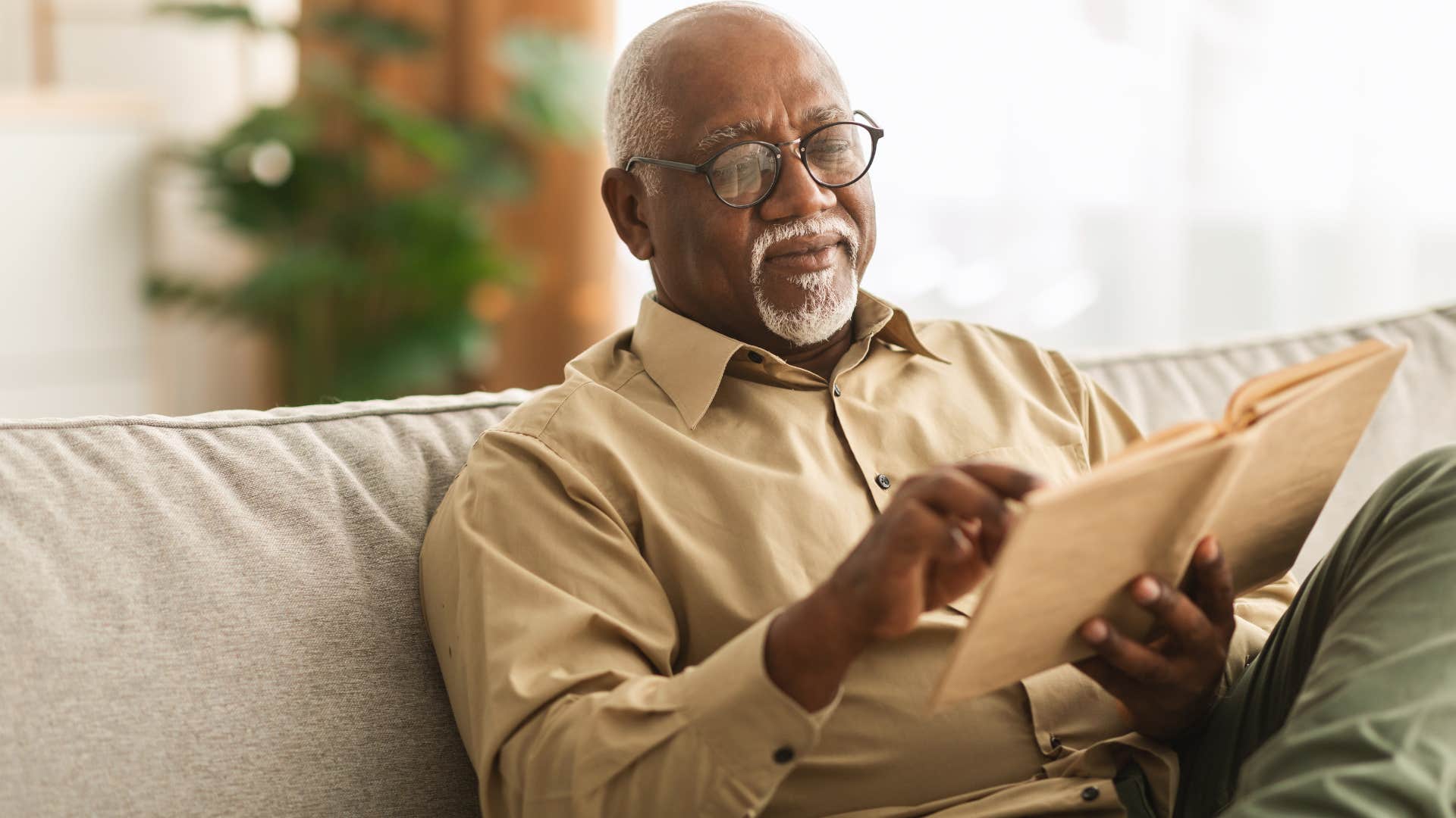 introverted man comfortable with silence reading a book
