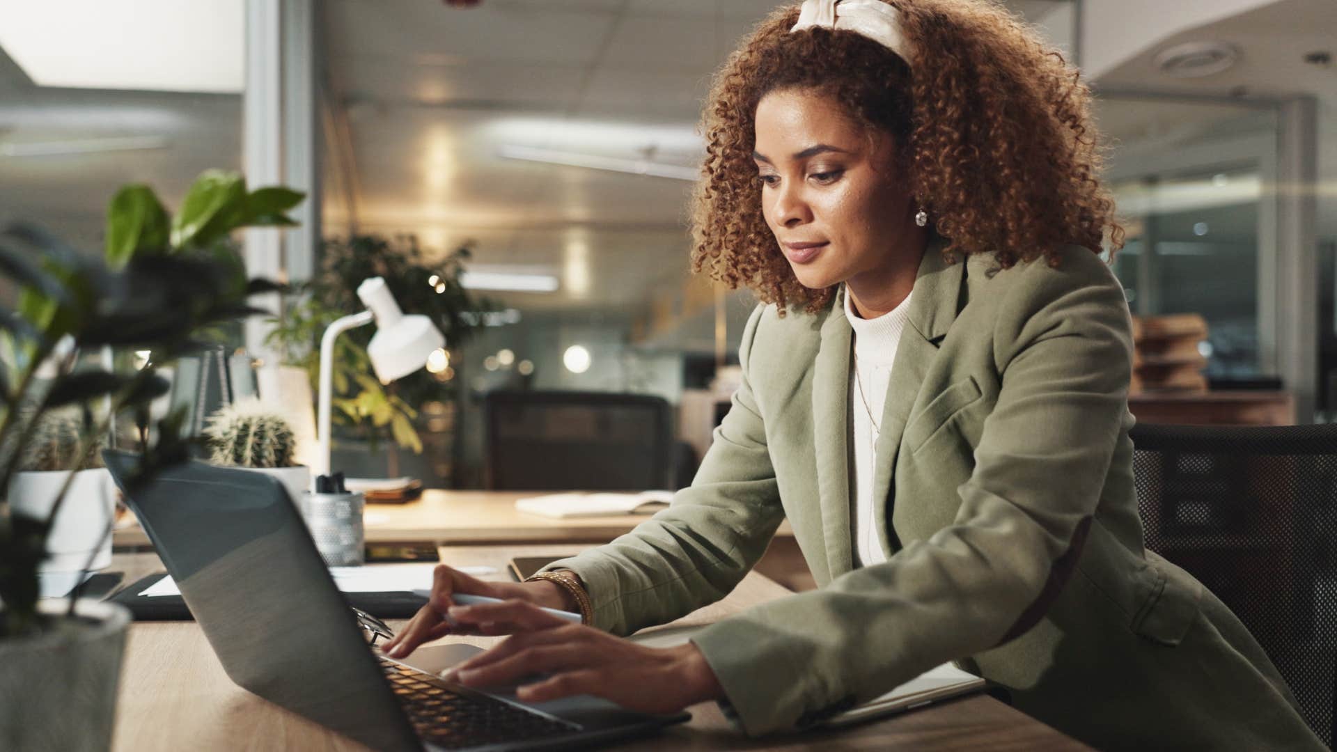 mysterious woman working on her laptop