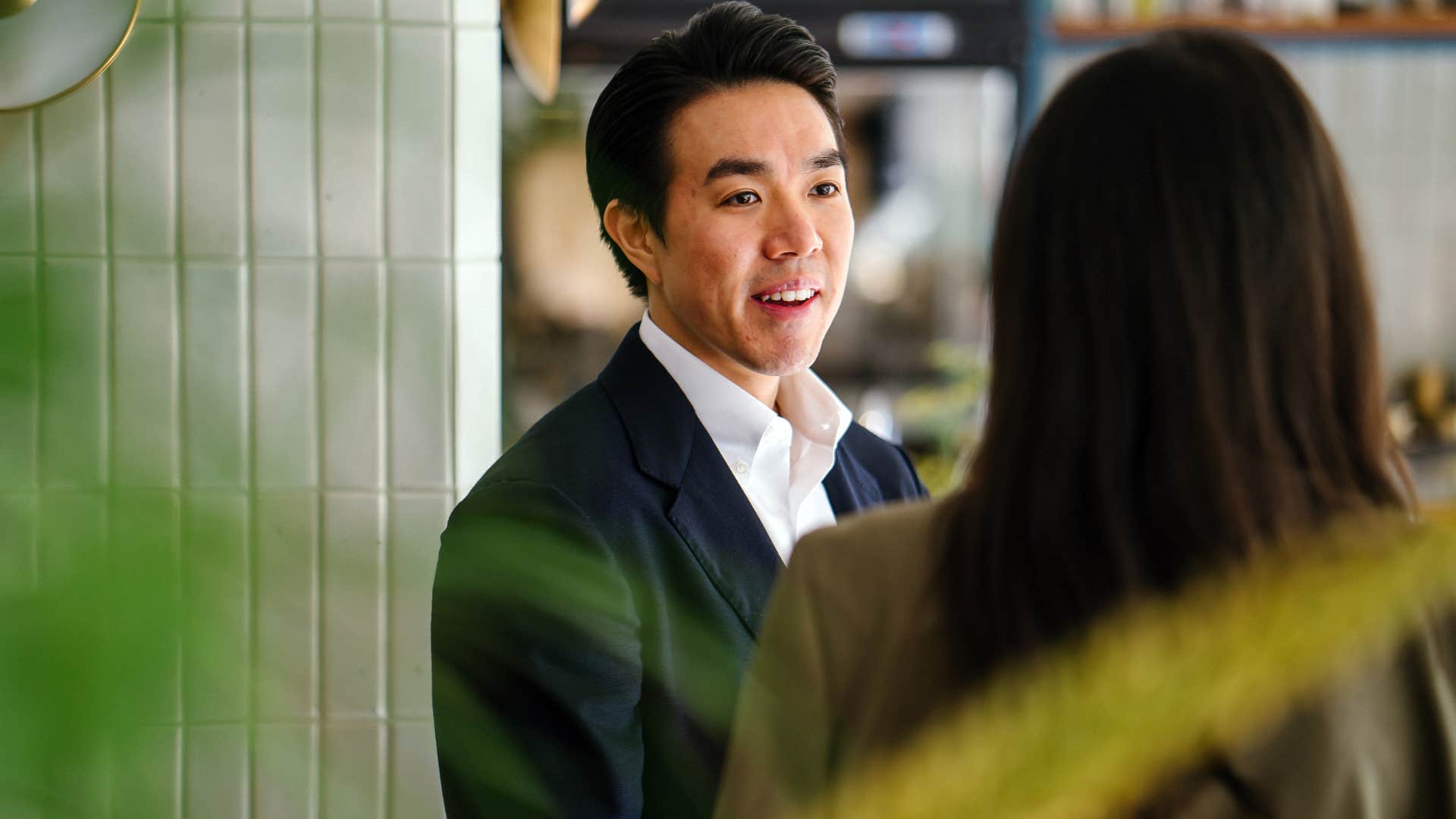 self-aware man talking to a co-worker