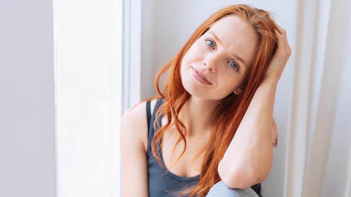 woman homebody sitting at home thinking