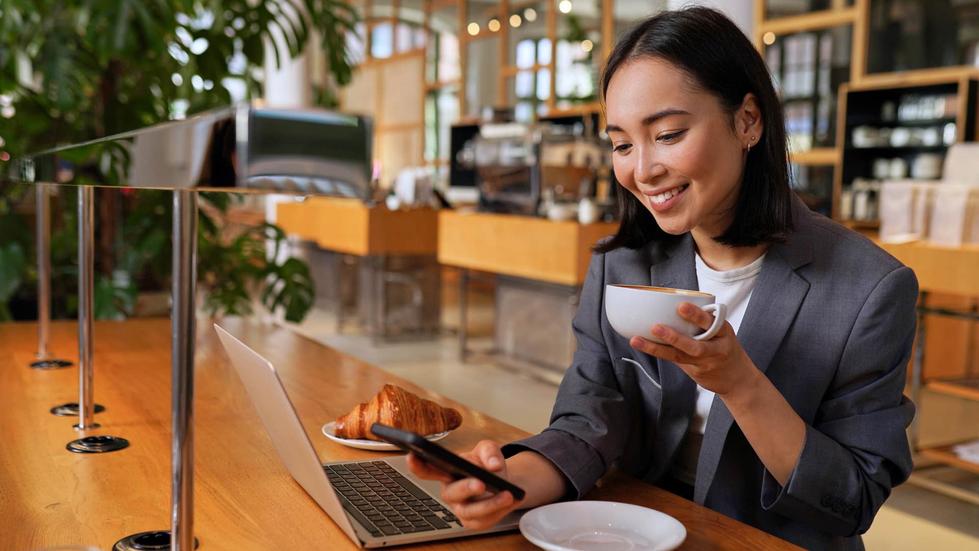 woman drinking a coffee in a cafe
