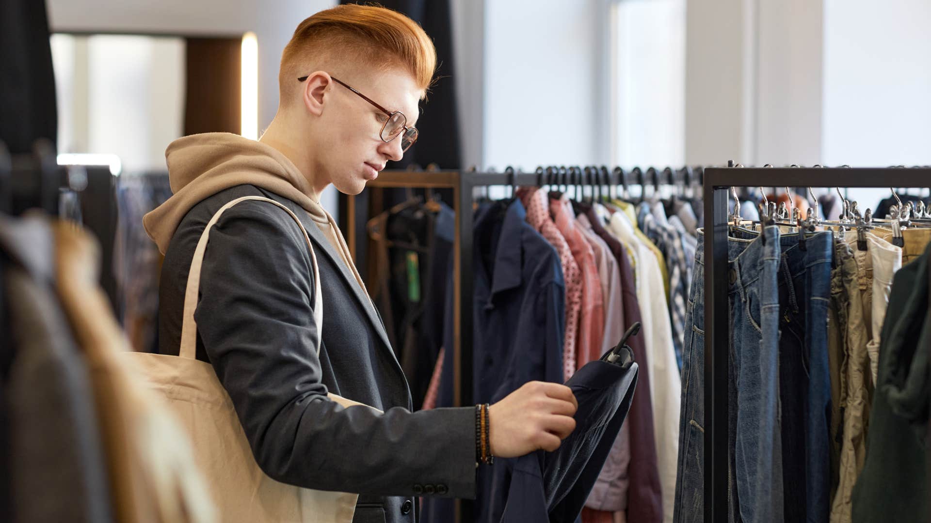 introverted man doing retail therapy shopping
