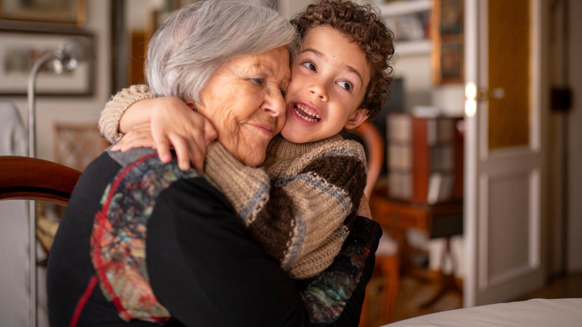 woman smiling and visiting family