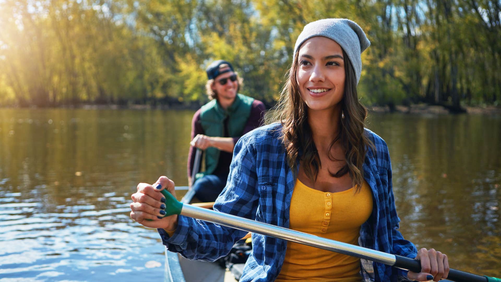 happy woman rowing who didnt give up her identity for a relationship