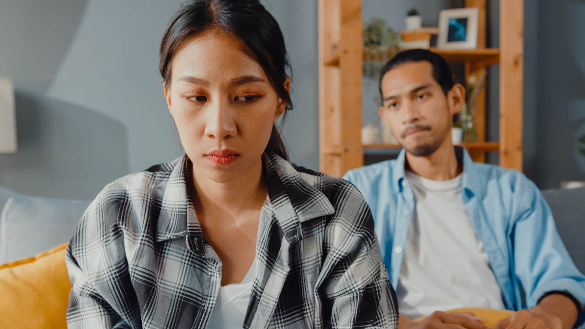 woman turned away from husband thinking you're always the problem