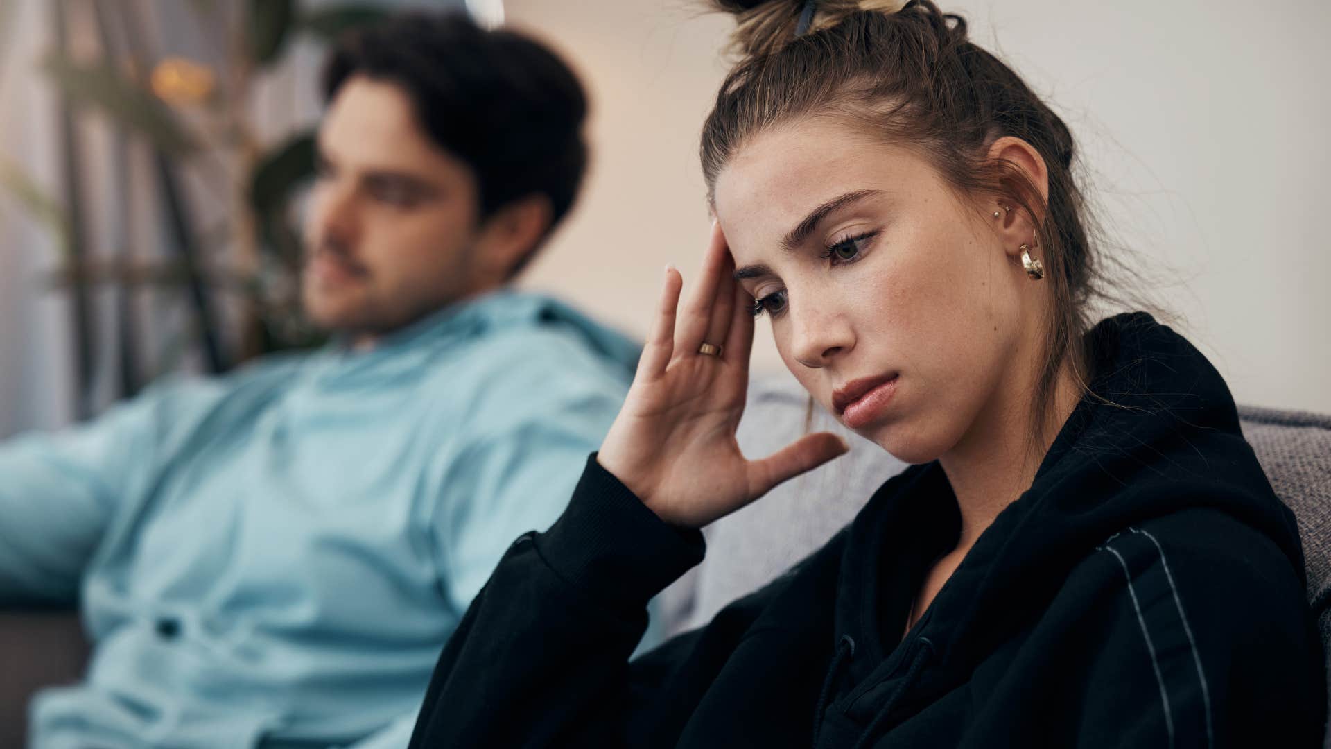 woman thinking you always ruin everything turned away from her husband