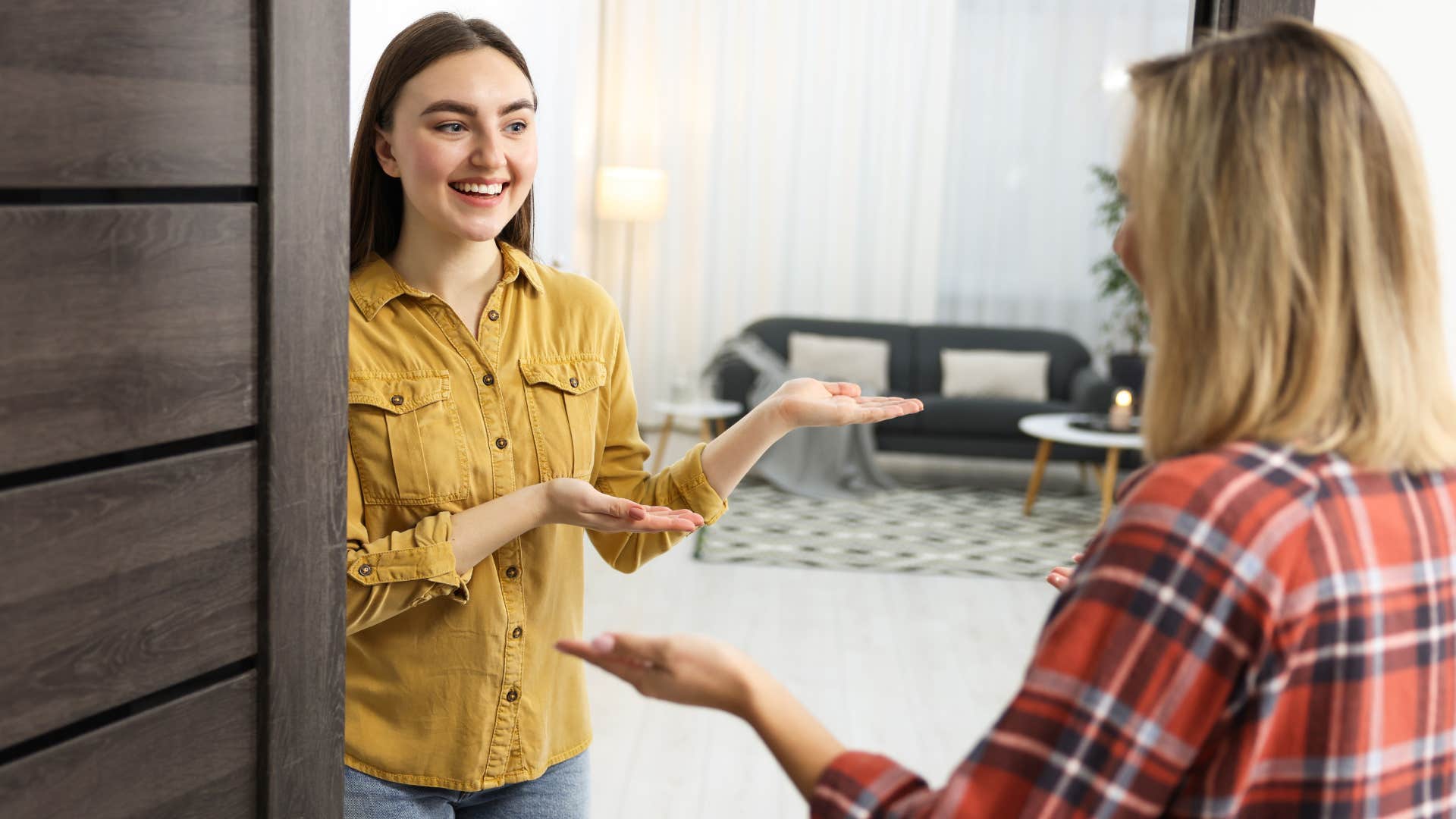 introverted woman having an unannounced visit with a friend