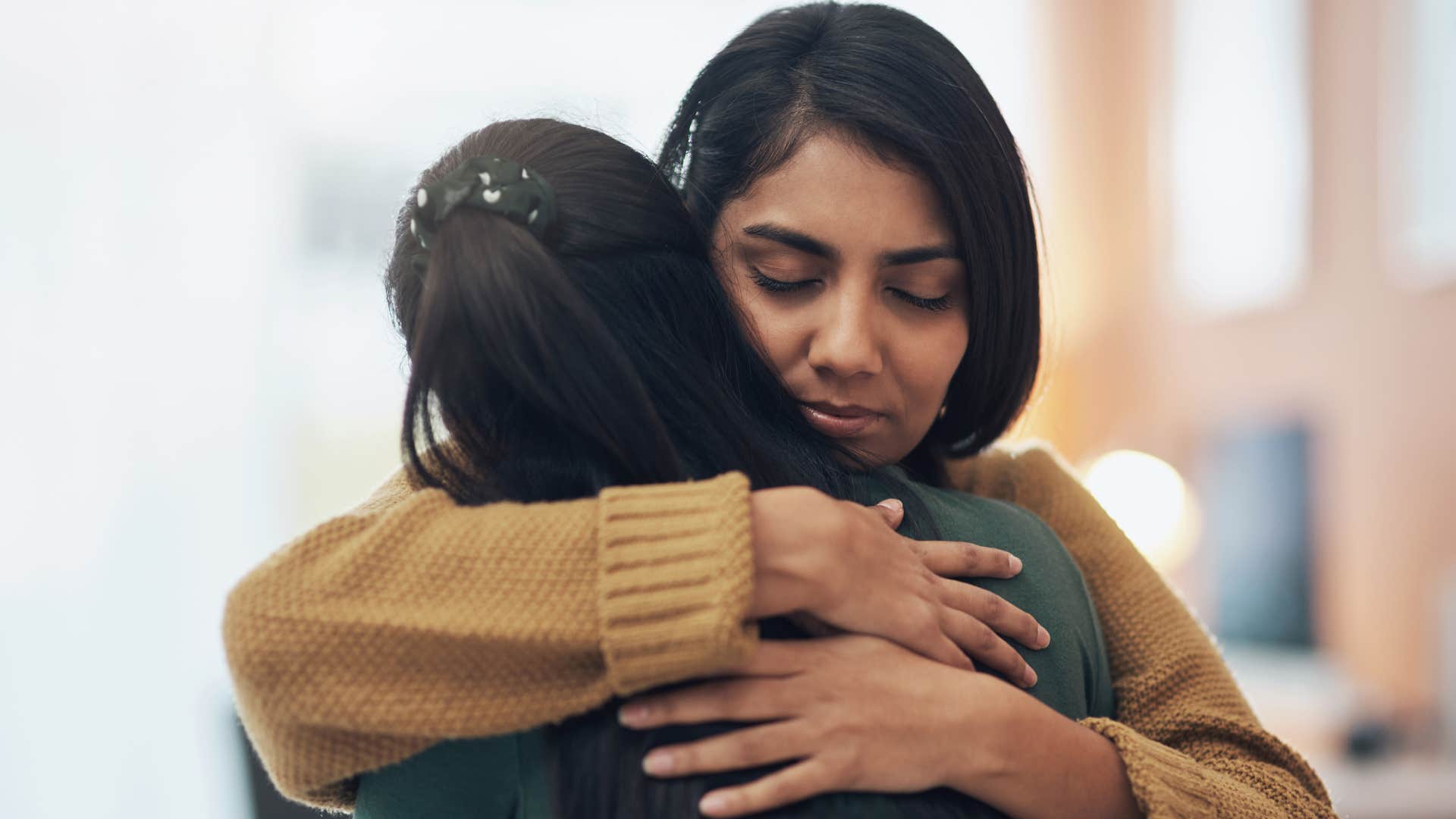 woman hugging friend