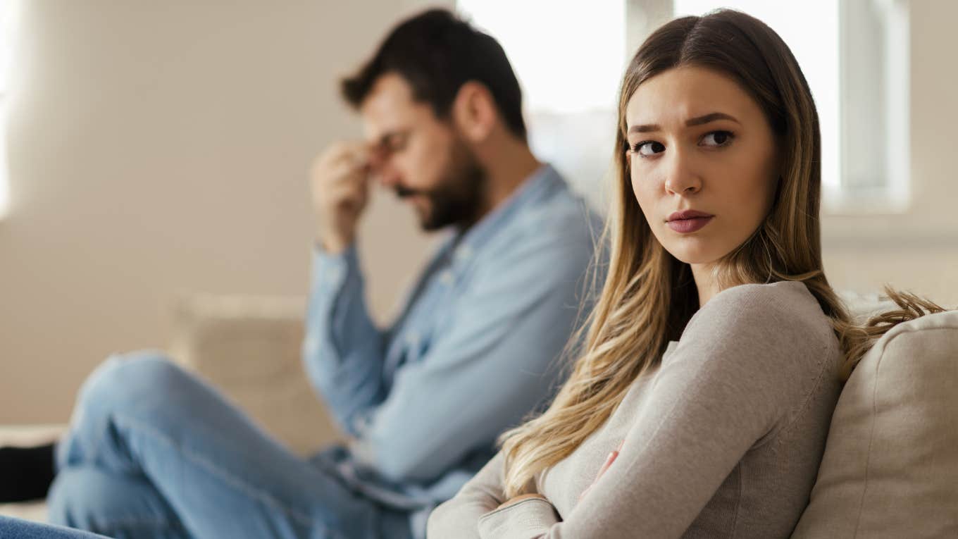wife turned away from husband looking sad