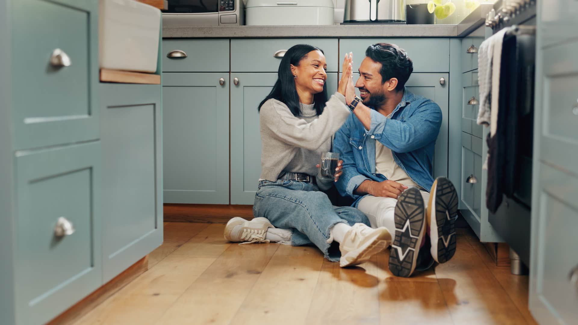 couple being their authentic selves sitting in kitchen together