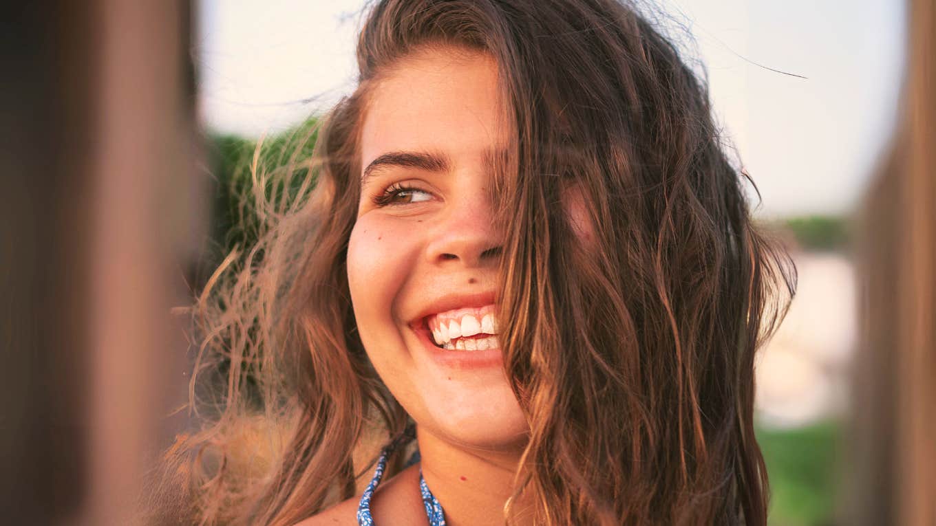 Calm happier human after letting go of perfectionist habits. 