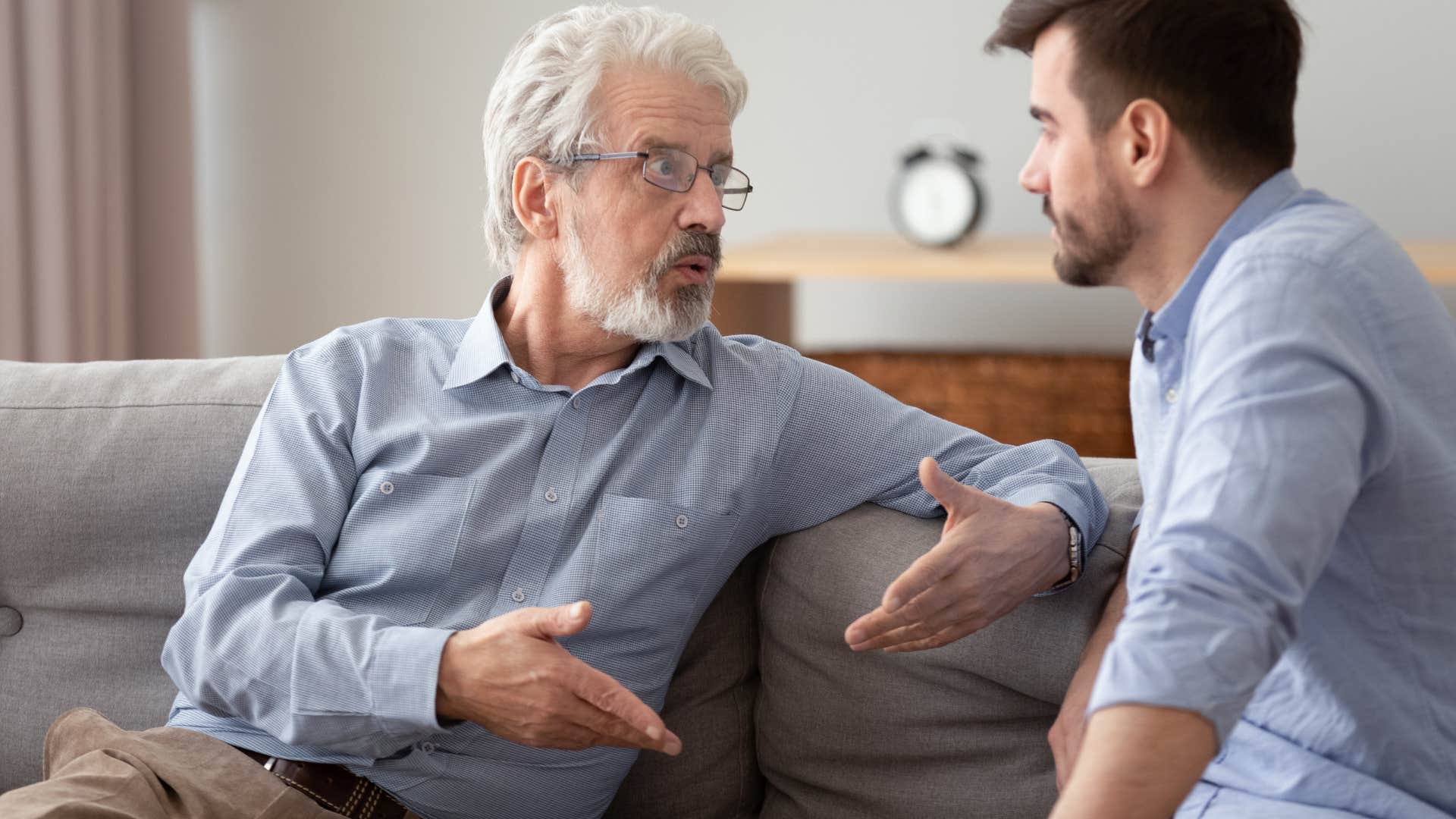 boomer man offering advice to his adult son