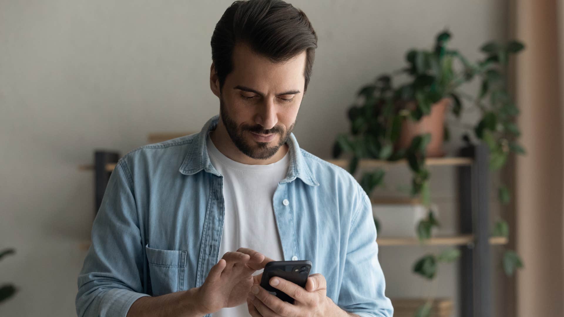 man bookmarking important posts on his phone