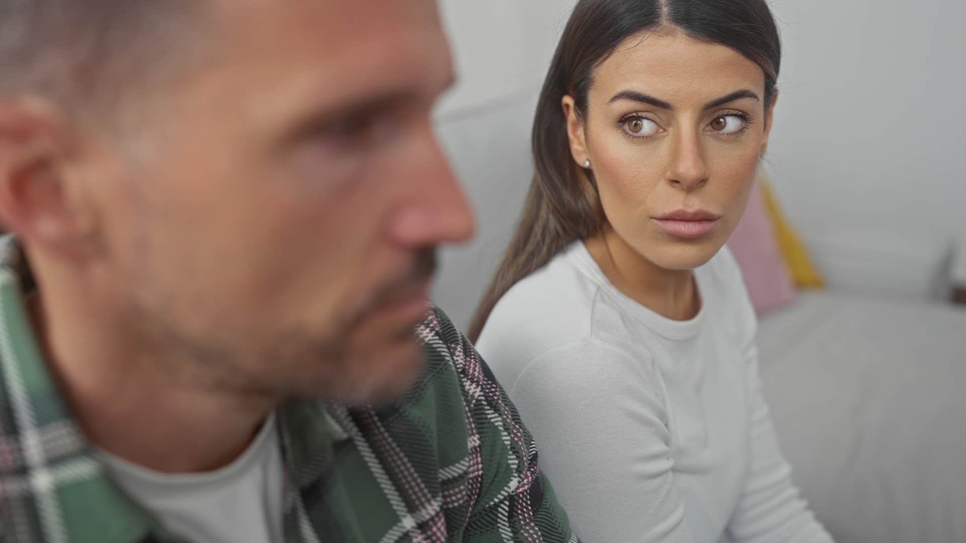man taking emotions personally turned away from upset wife