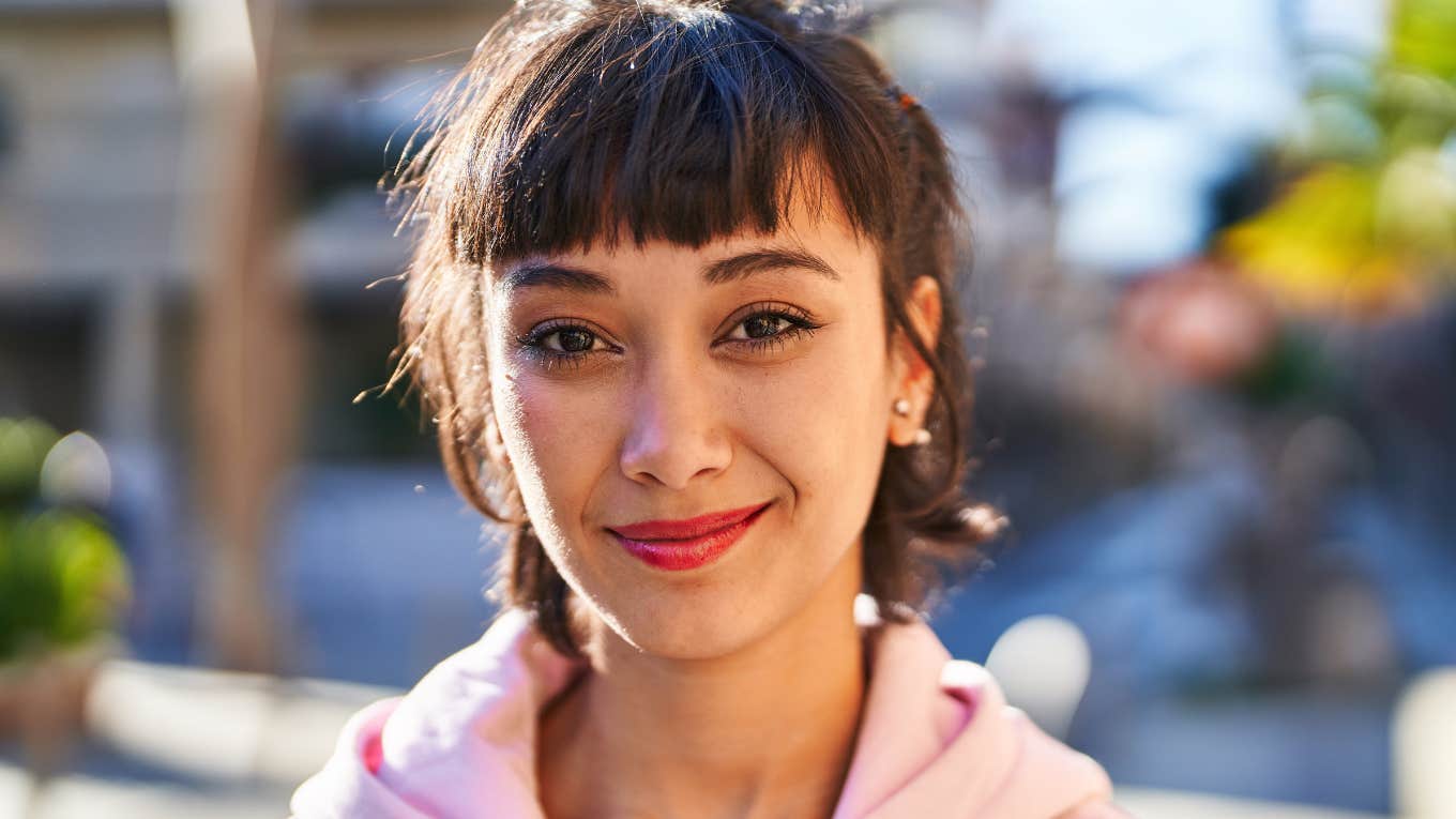 assertive young woman smiling confidently