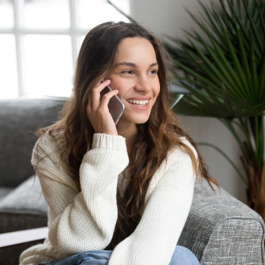 woman who is picking up phone as it reveals high emotional intelligence