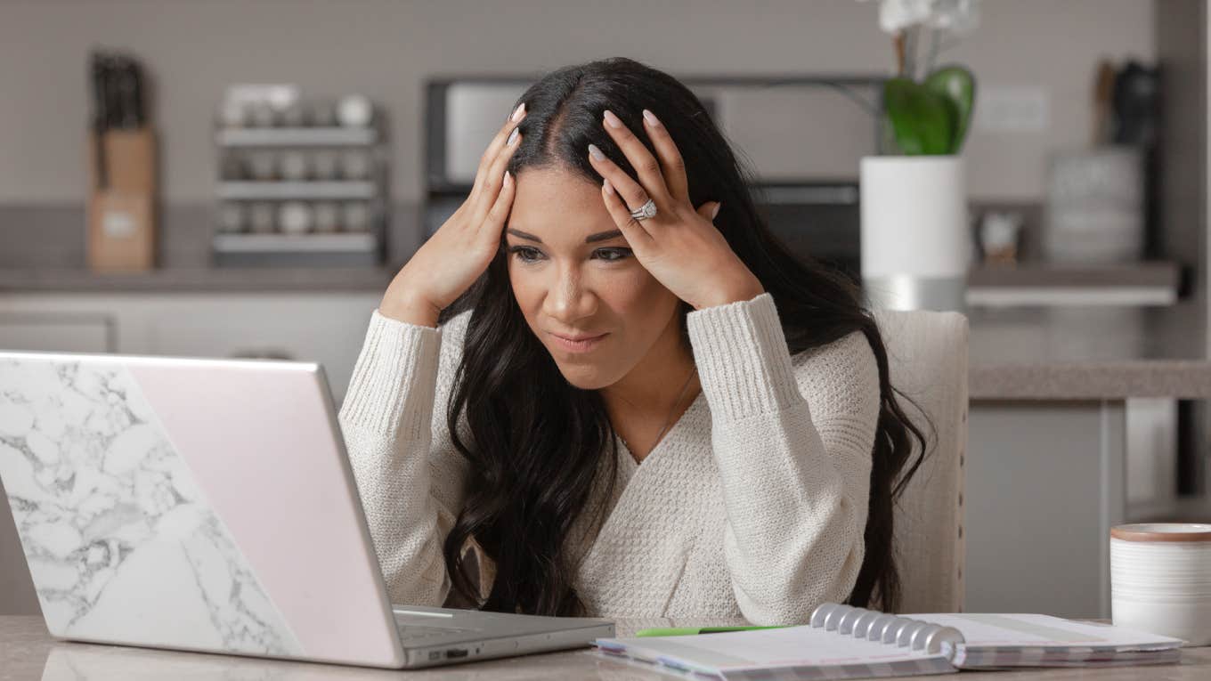 frustrated woman looking at laptop