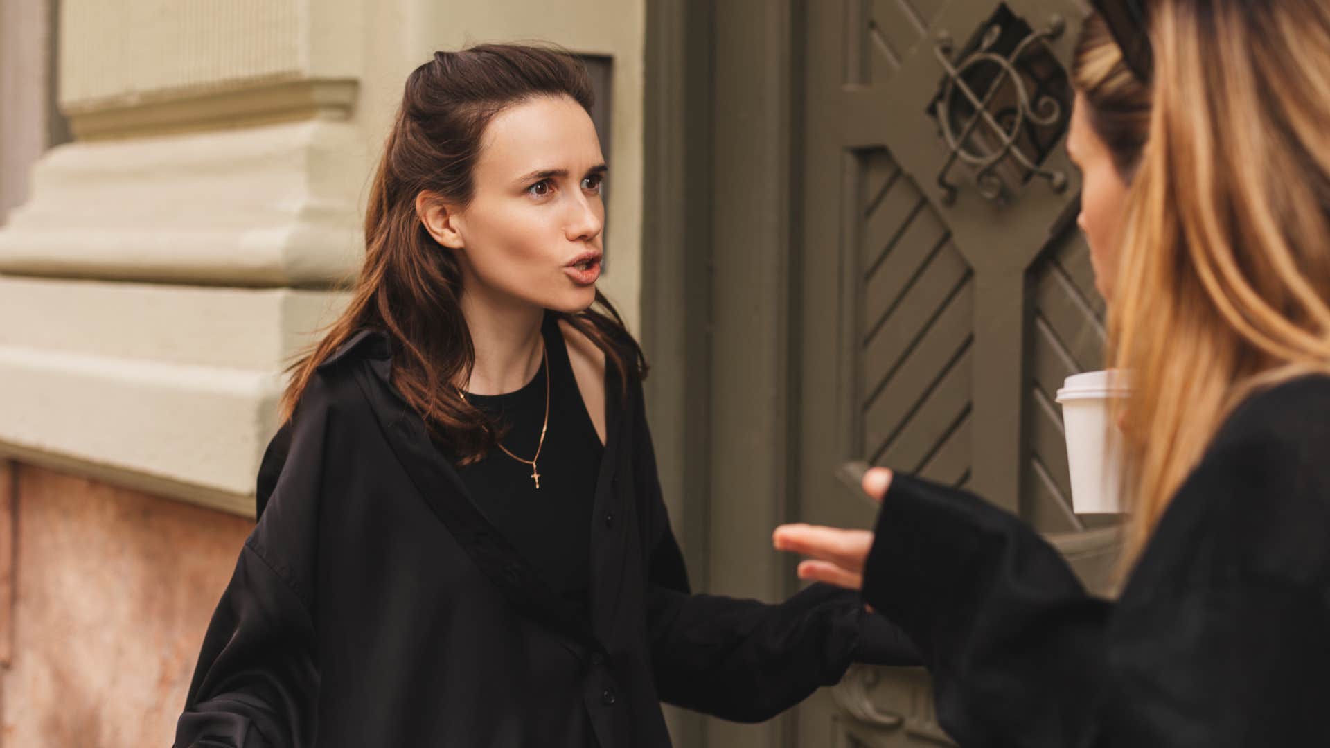 angry woman telling friend shes overreacting