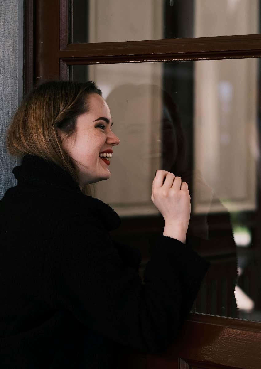 woman knocking on the front door of her childhood home