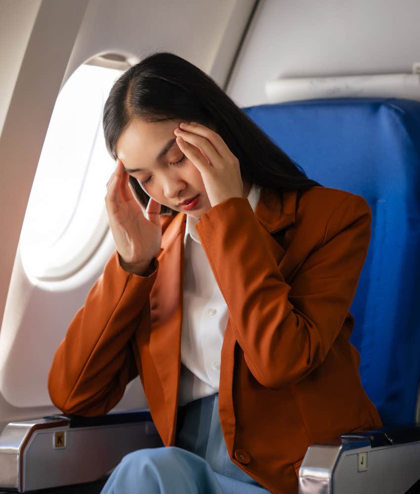 woman upset on plane