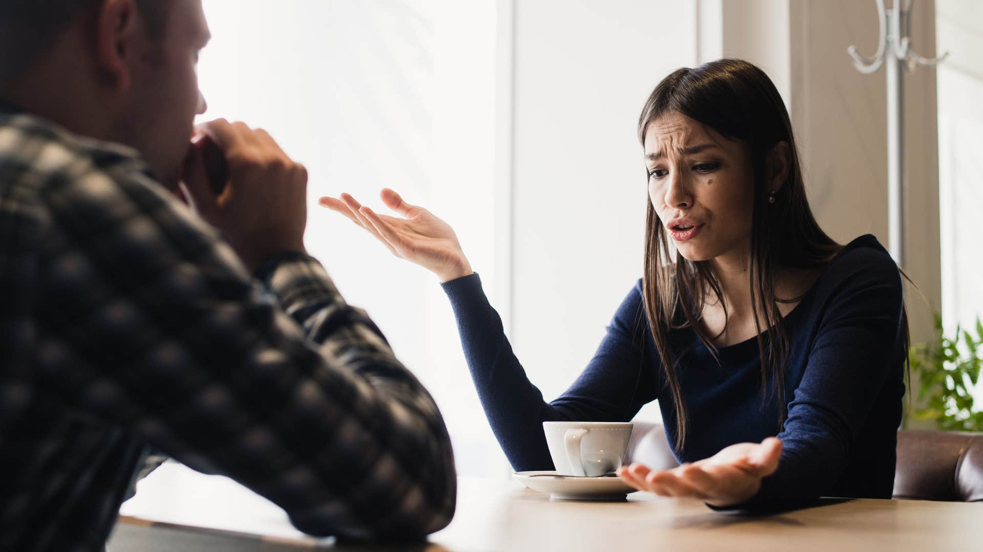 woman in black feels more like his roommate than his partner as she argues with partner