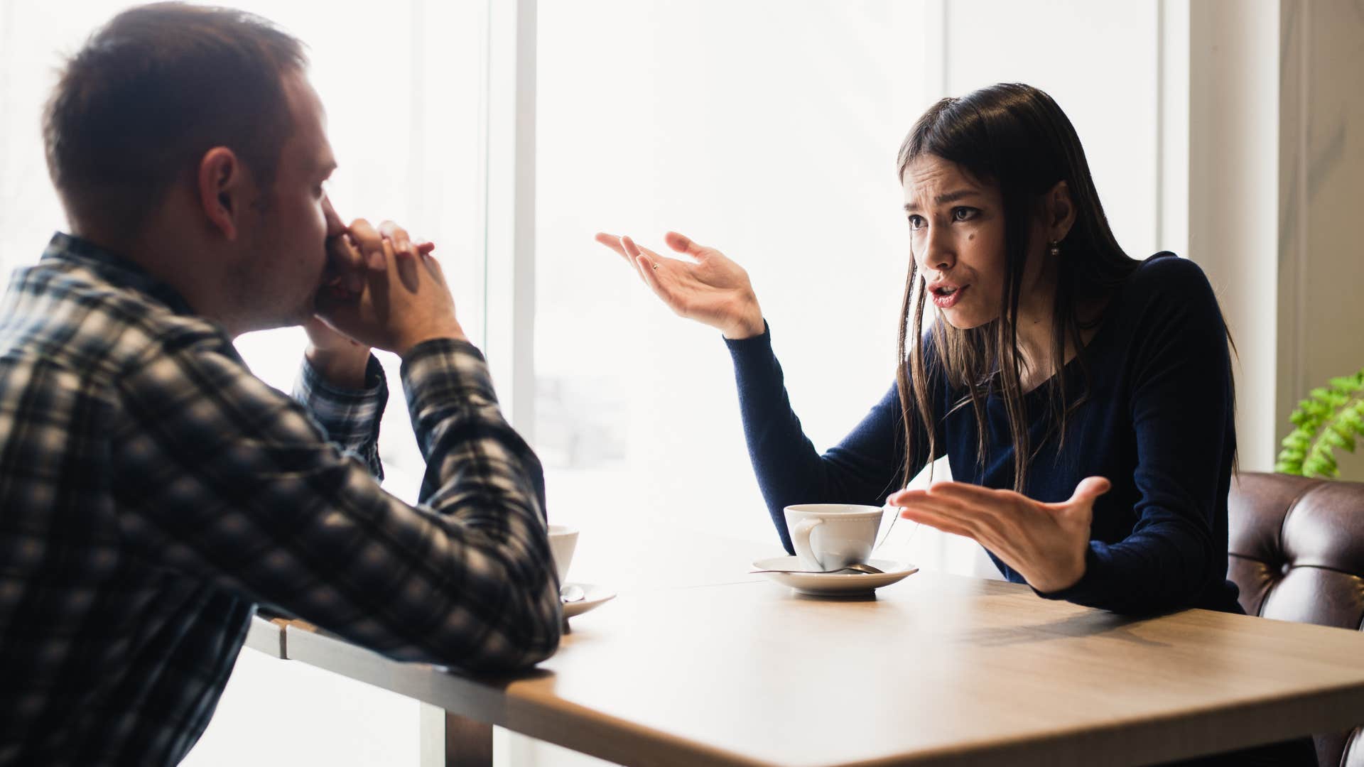 woman criticizing her husband at the dinner table