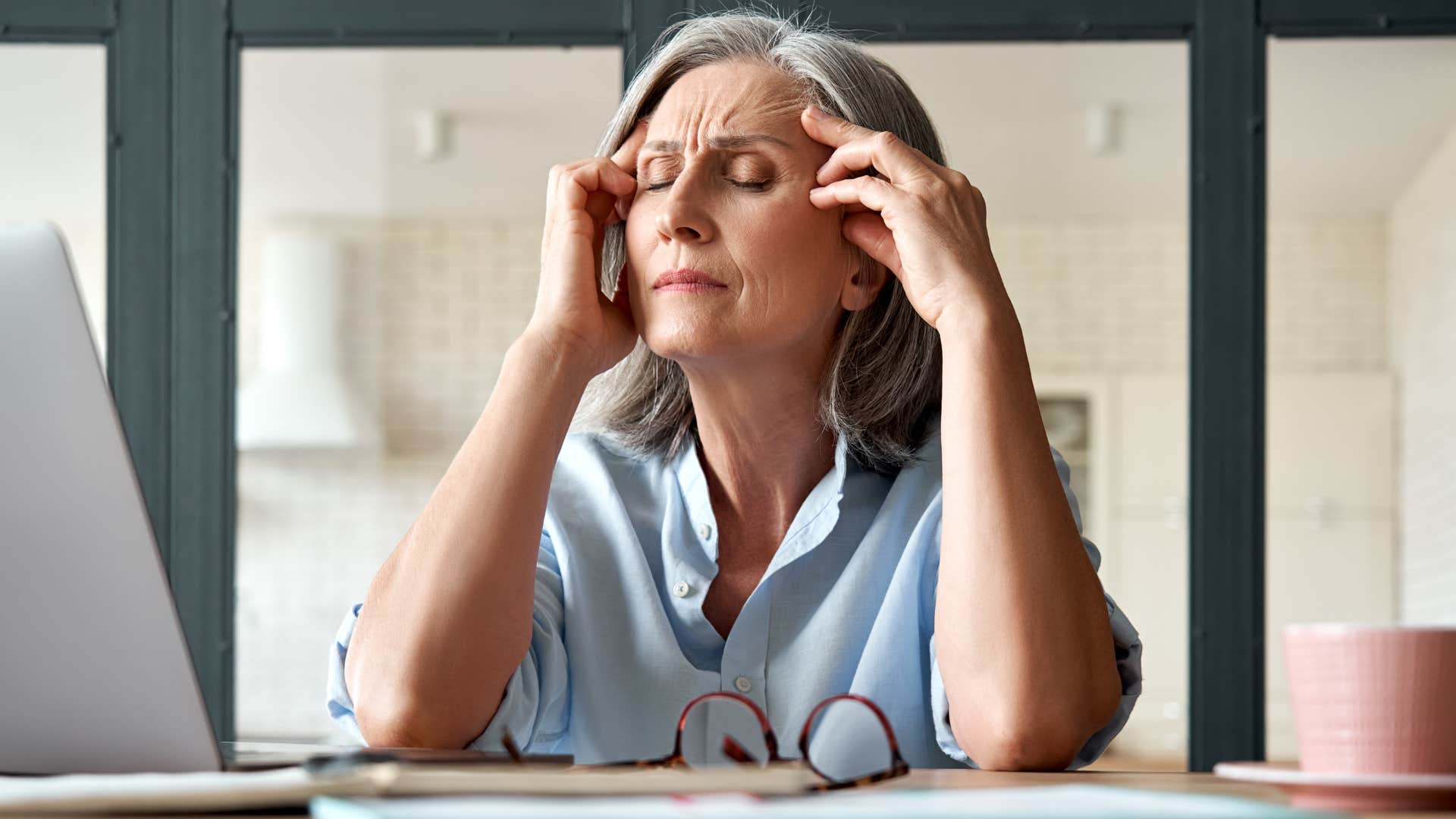Woman who doesn't have the time talking on the phone.