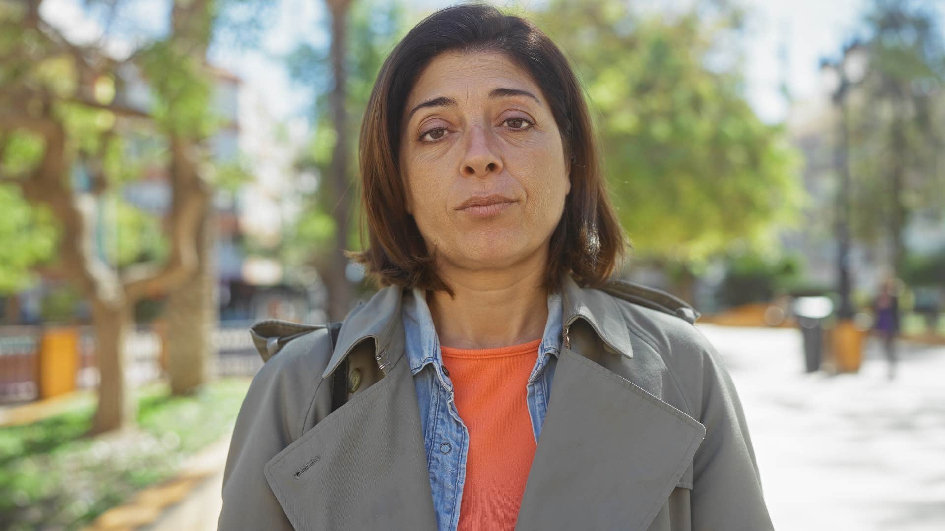 Woman who doesn't want to feel shamed looking at the camera.