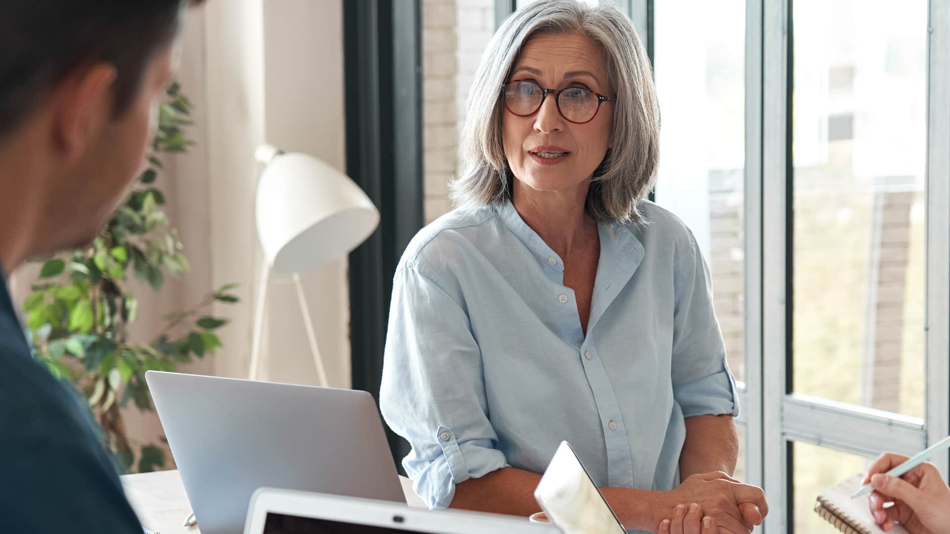 older woman being direct with male co-worker