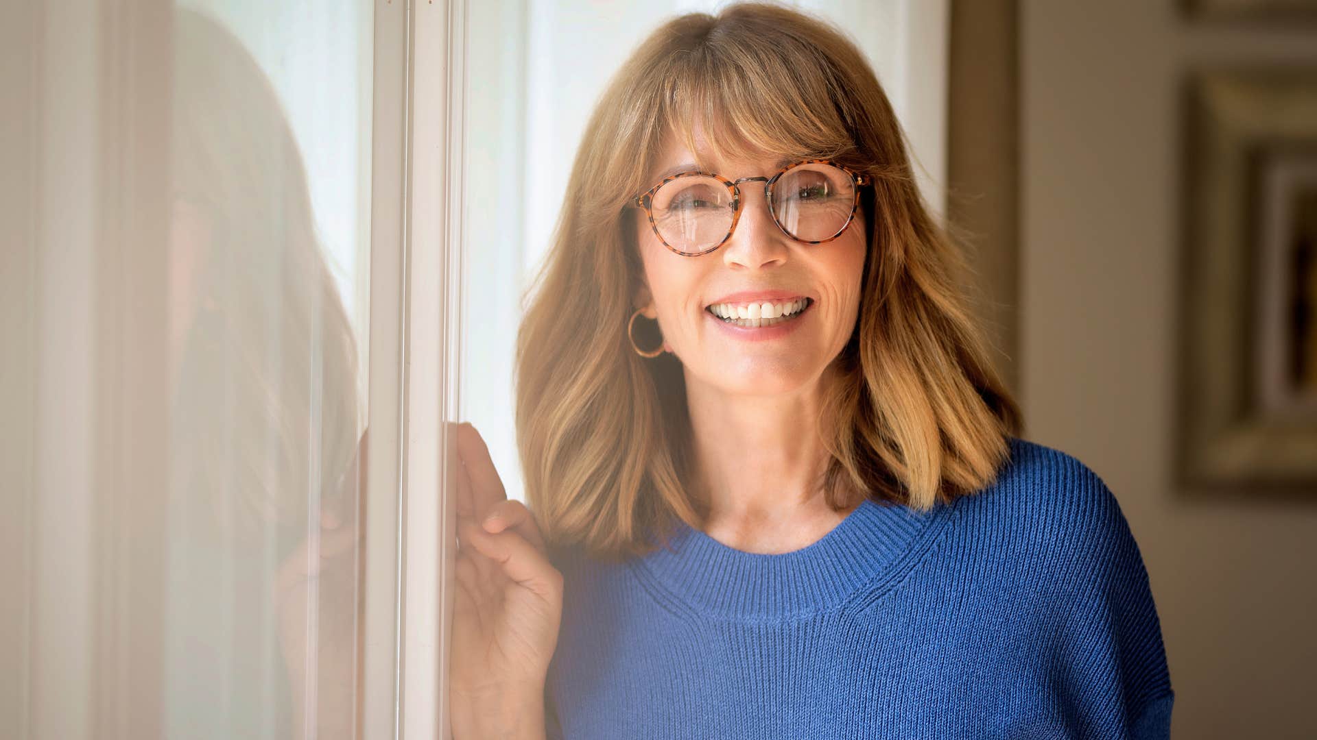 self-reliant older woman smiling at home