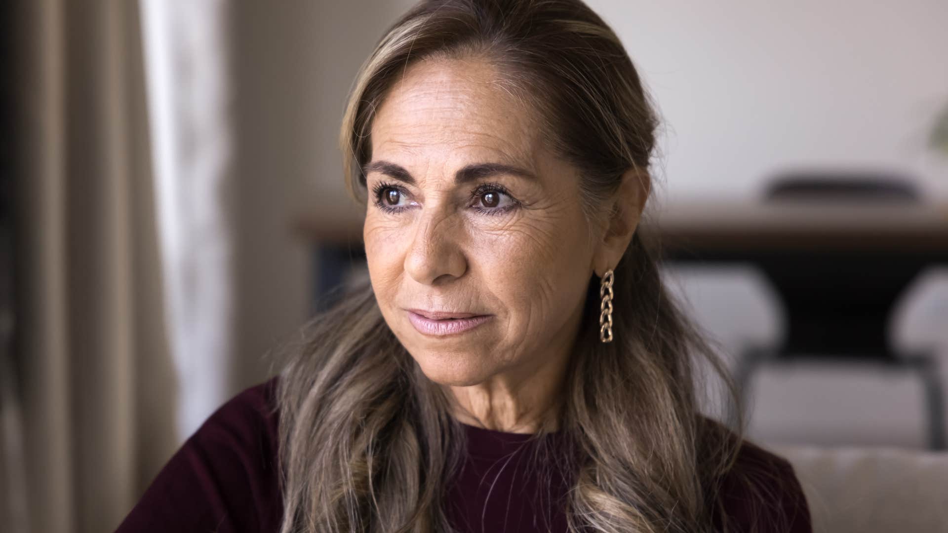 woman who's tired of doing invisible work sitting at home