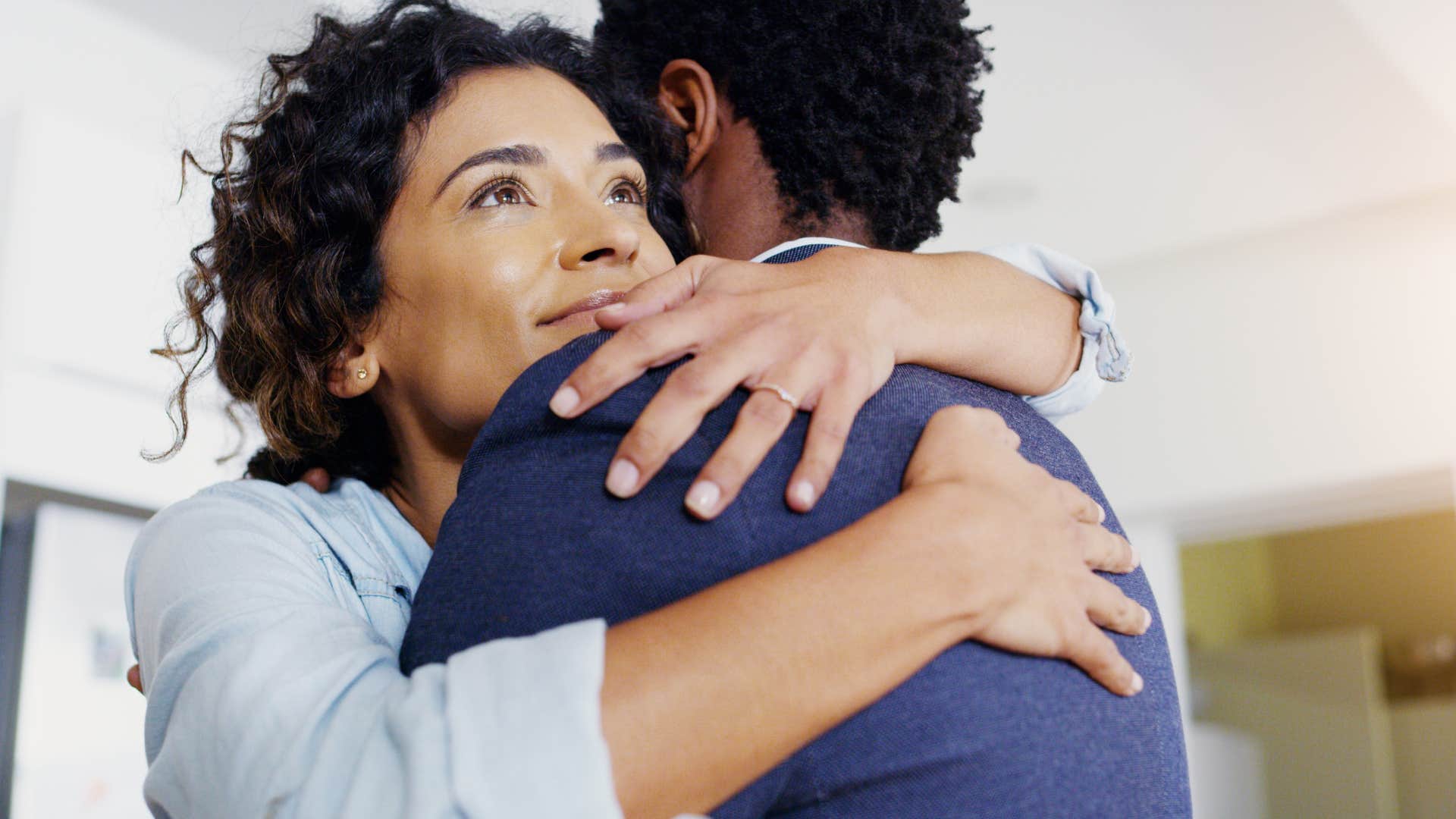wife hugging her husband