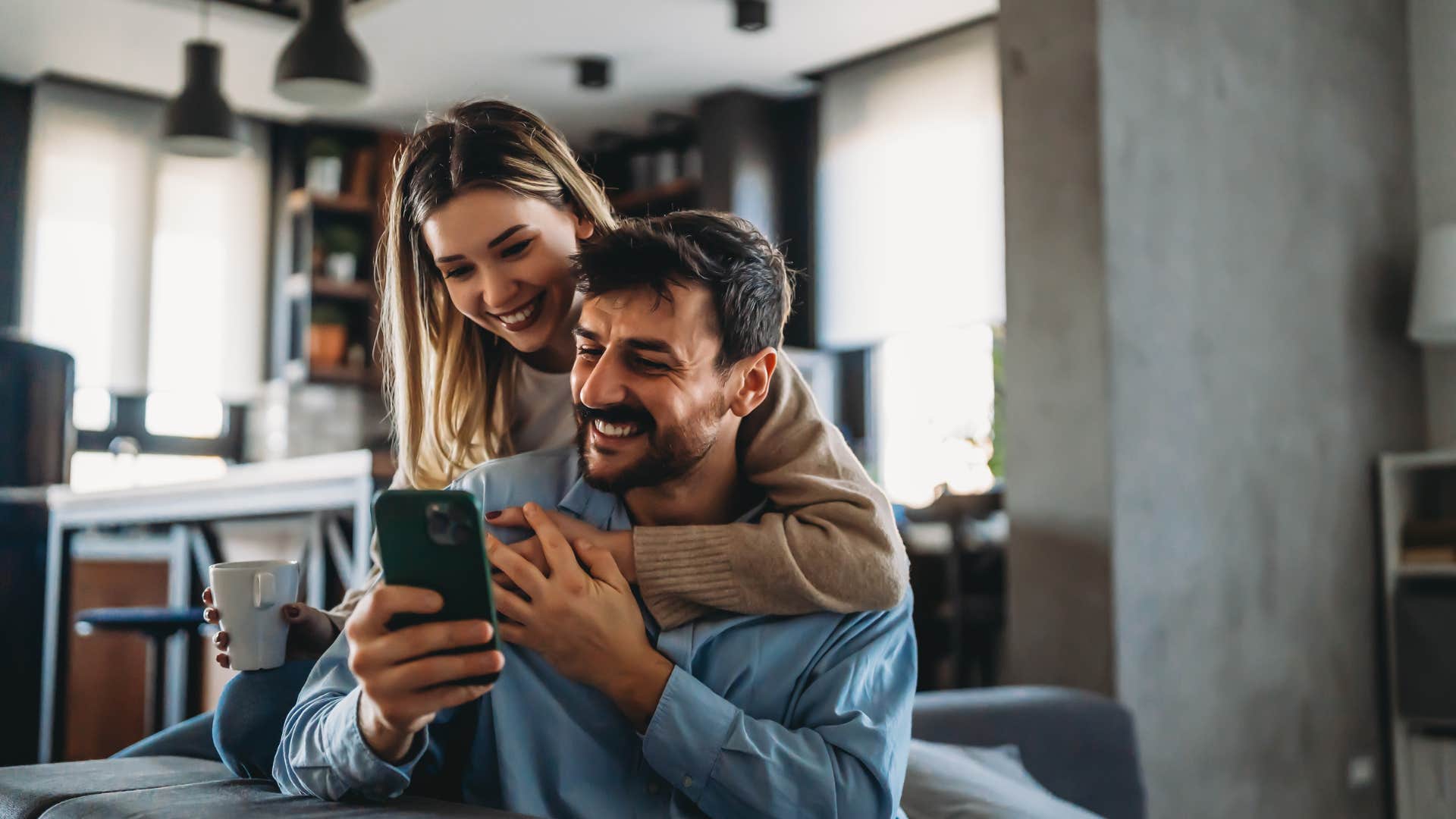 wife showing excitement about husband's idea on phone
