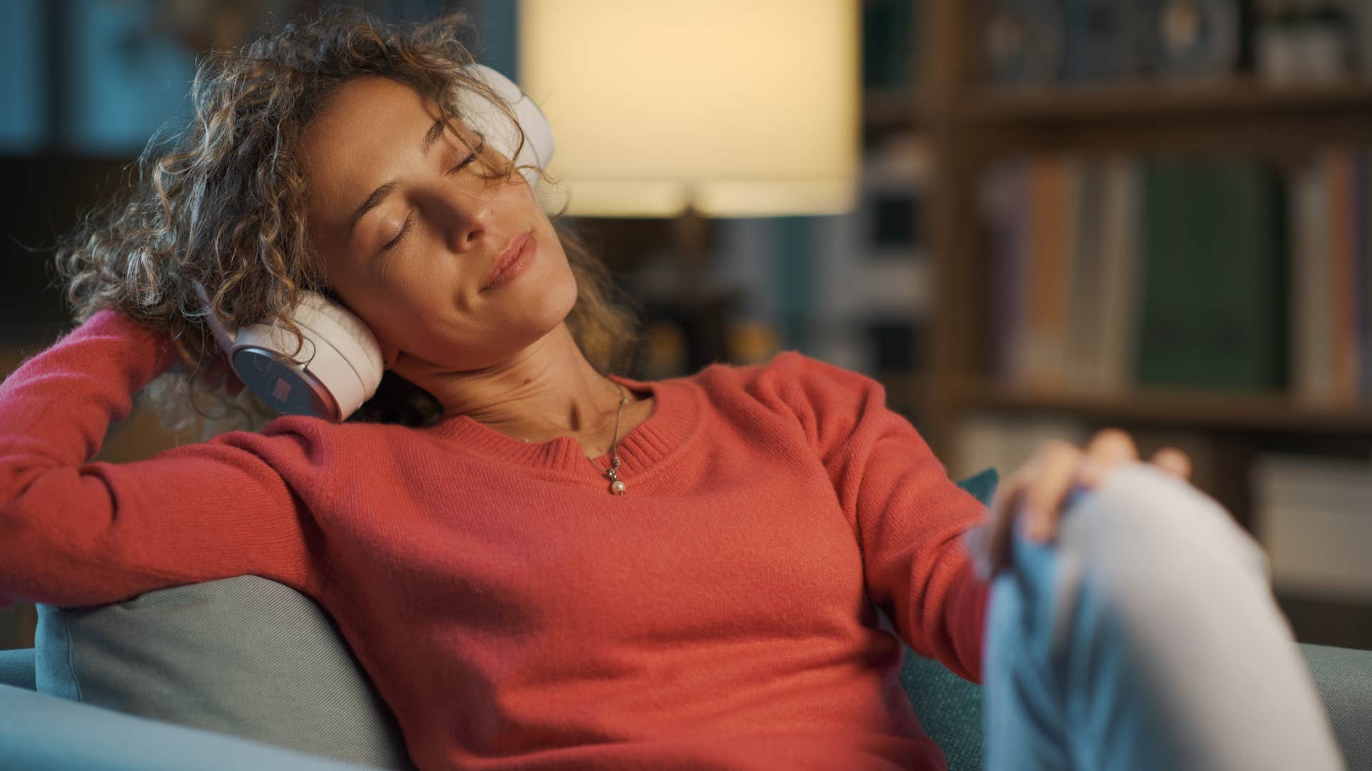 privileged woman ignoring the news relaxing with music instead