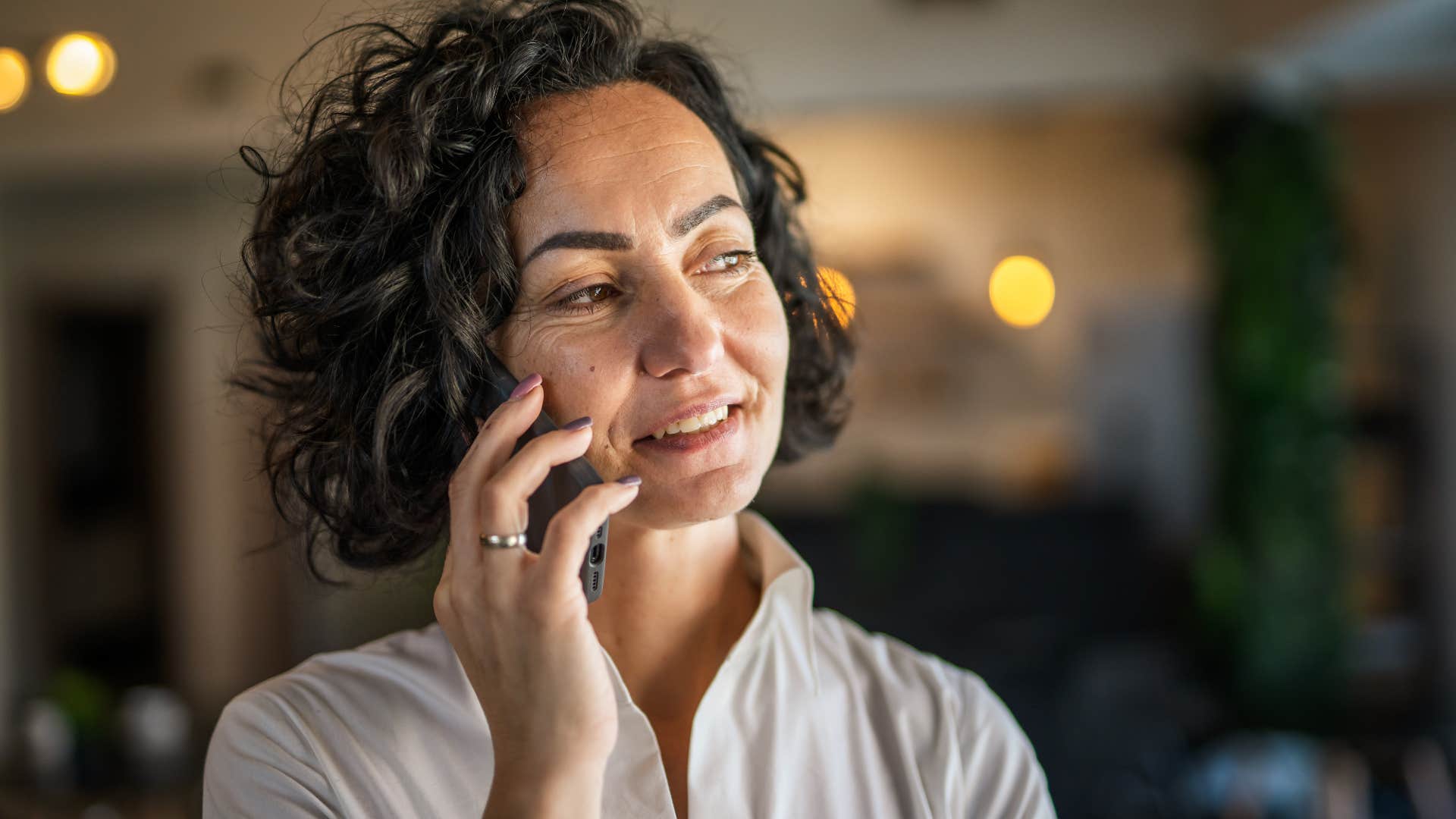 woman with a bustling social life talking on the phone