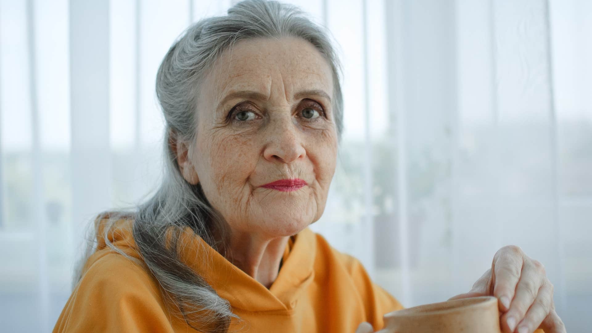 older woman feeling drained by too much social interaction