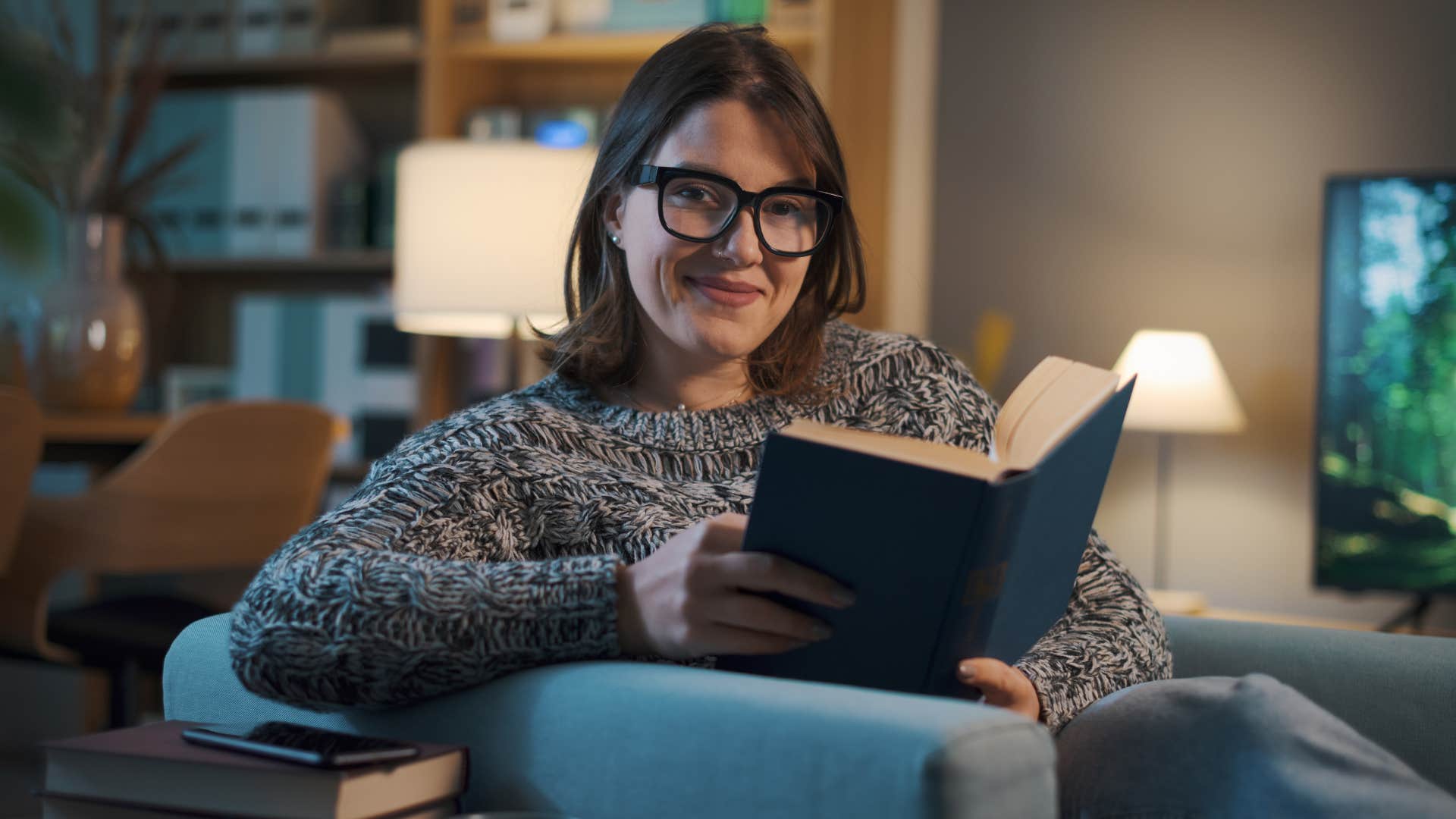 woman with personal hobbies reading at home