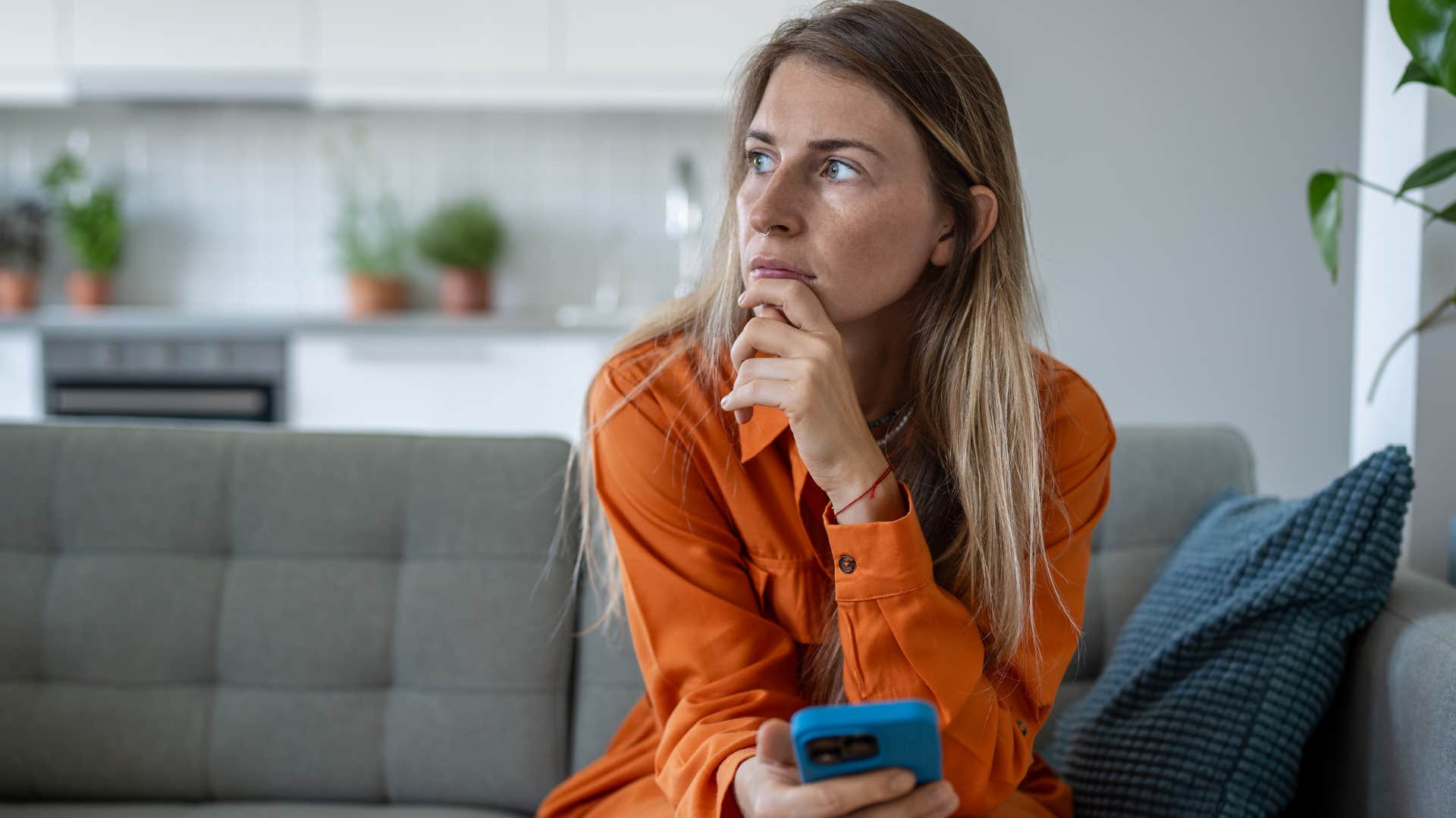 woman who doesn't entertain superficial interactions sitting at home