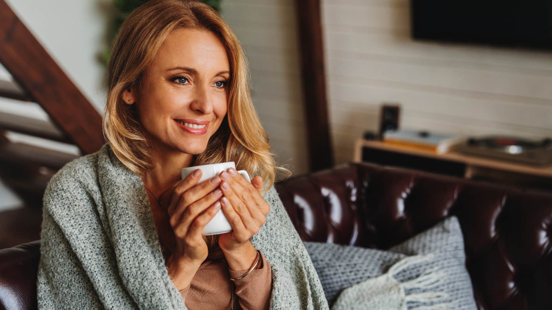 woman who's strict about self-care drinking tea at home