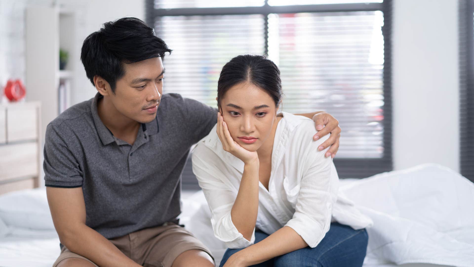 man noticing wifes moods and comforting her