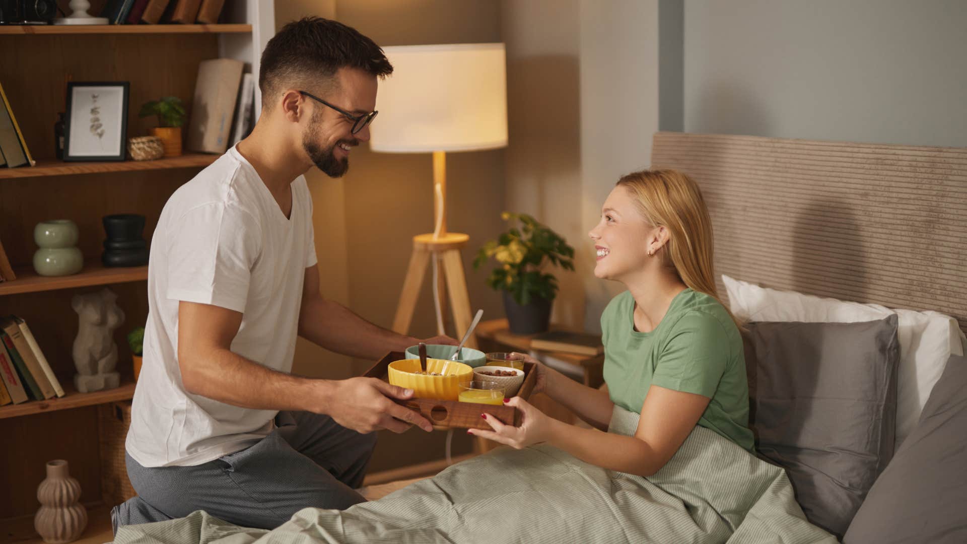 man serving his wife breakfast in bed remembering the little things